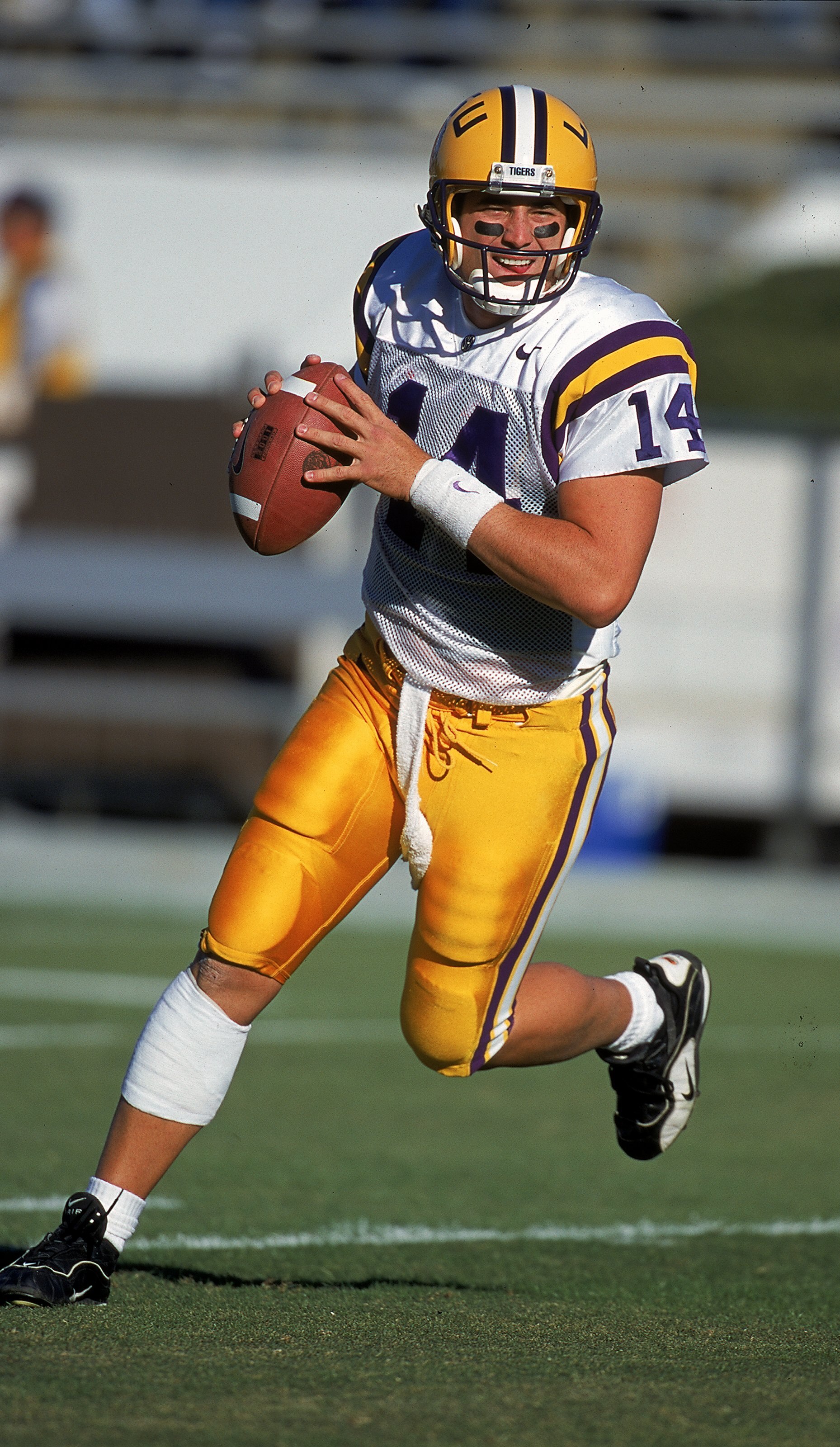 23 Oct 1999:  Josh Booty #14 of the LSU Tigers moves with the ball during the game against the Mississippi State Bulldogs at the Scott Stadium in Starkville, Mississippi. The Bulldogs defeated the Tigers 17-16. Mandatory Credit: Scott Halleran  /Allsport
