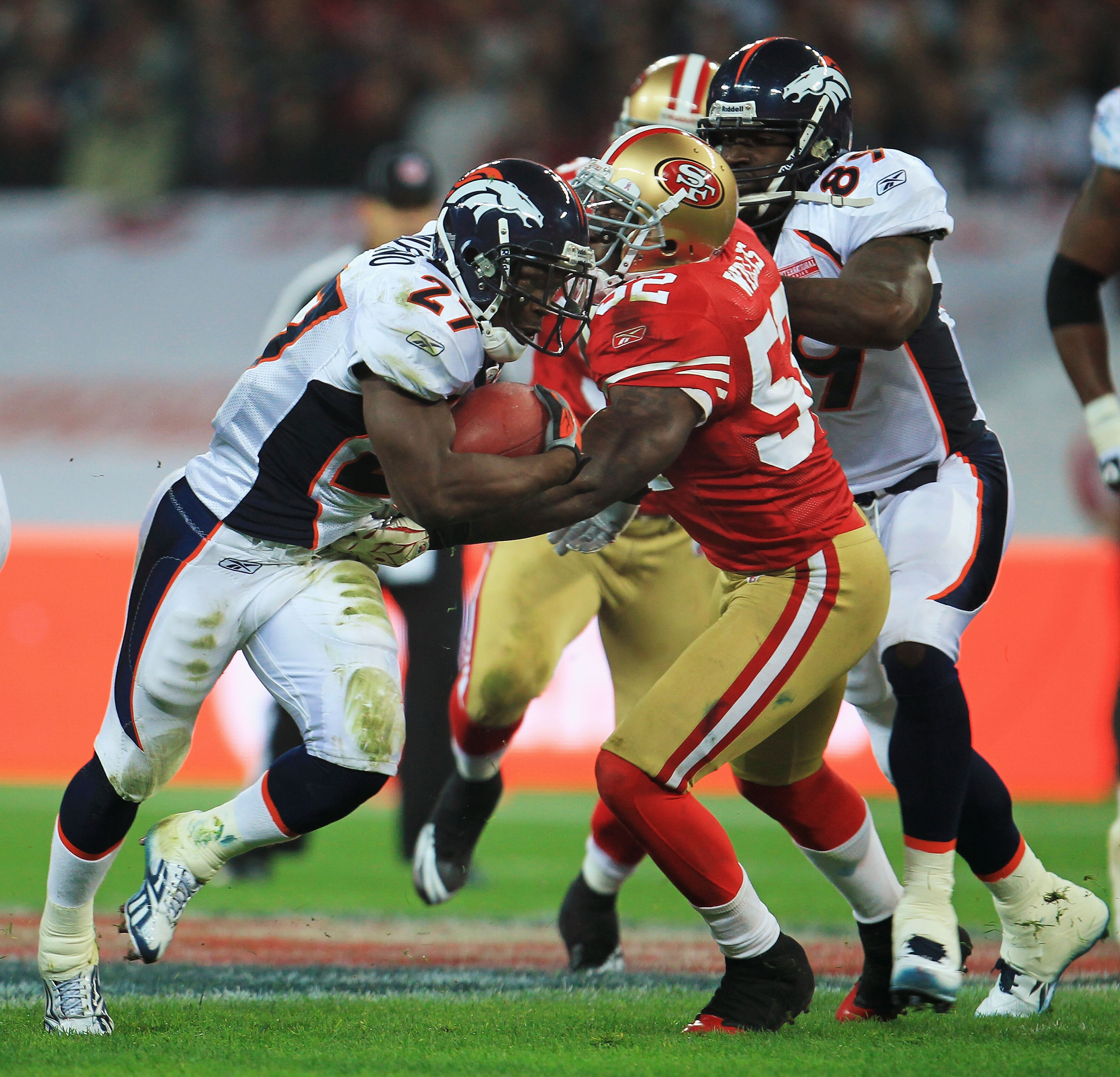 LONDON, ENGLAND - OCTOBER 31:  Knowshon Moreno #27 of Denver Broncos is blocked by Patrick Willis #52 of San Francisco 49ers during the NFL International Series match between Denver Broncos and San Francisco 49ers at Wembley Stadium on October 31, 2010 in
