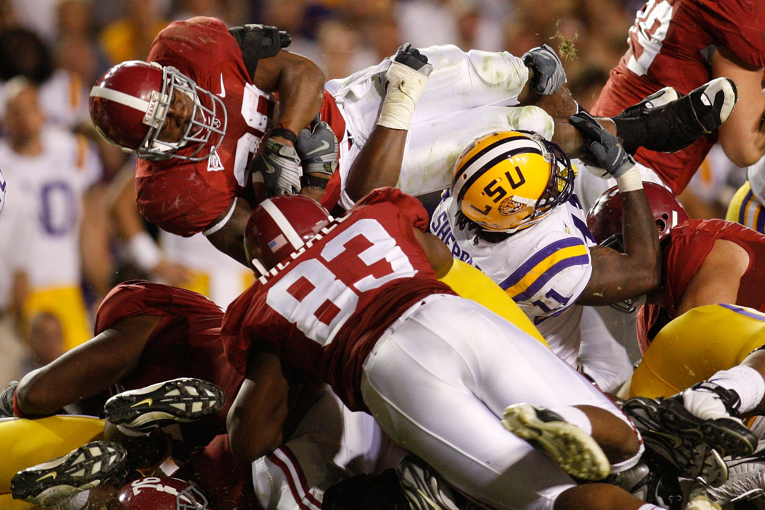 BATON ROUGE, LA - NOVEMBER 08:  Glen Coffee #38 of the Alabama Crimson Tide jumps over Kelvin Sheppard #11 of the Louisiana State University Tigers on November 11, 2008 at Tiger Stadium in Baton Rouge, Louisiana. The Tide defeated the Tigers 27-21 in over