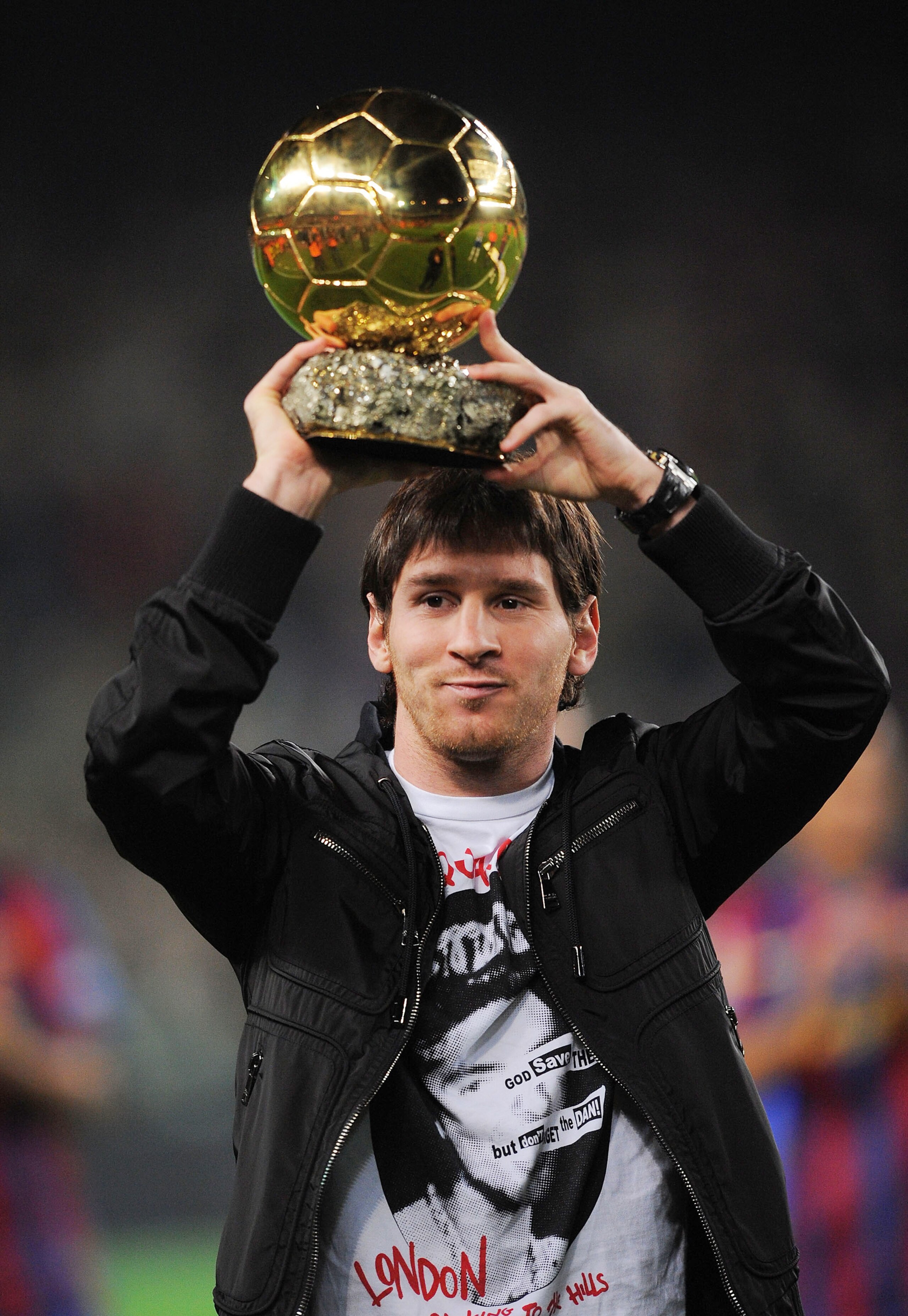 BARCELONA, SPAIN - DECEMBER 12:  Lionel Messi holds up his European footballer of the year award, the 'Ballon d'Or' (Golden ball), before the La Liga match between Barcelona and  Espanyol at the Camp Nou stadium Stadium on December 12, 2009 in Madrid, Spa
