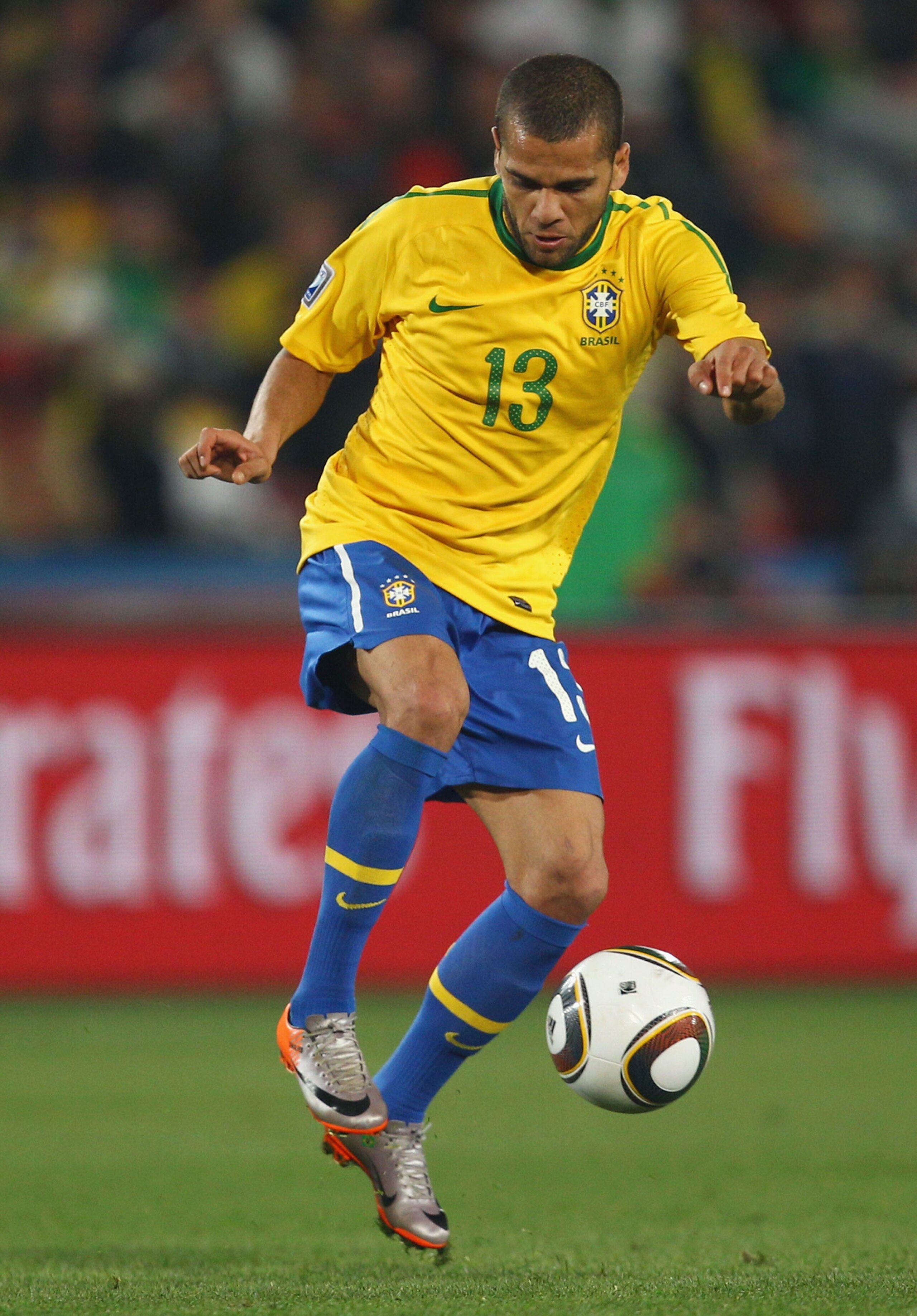 JOHANNESBURG, SOUTH AFRICA - JUNE 28:  Dani Alves of Brazil controls the ball during the 2010 FIFA World Cup South Africa Round of Sixteen match between Brazil and Chile at Ellis Park Stadium on June 28, 2010 in Johannesburg, South Africa.  (Photo by Rich