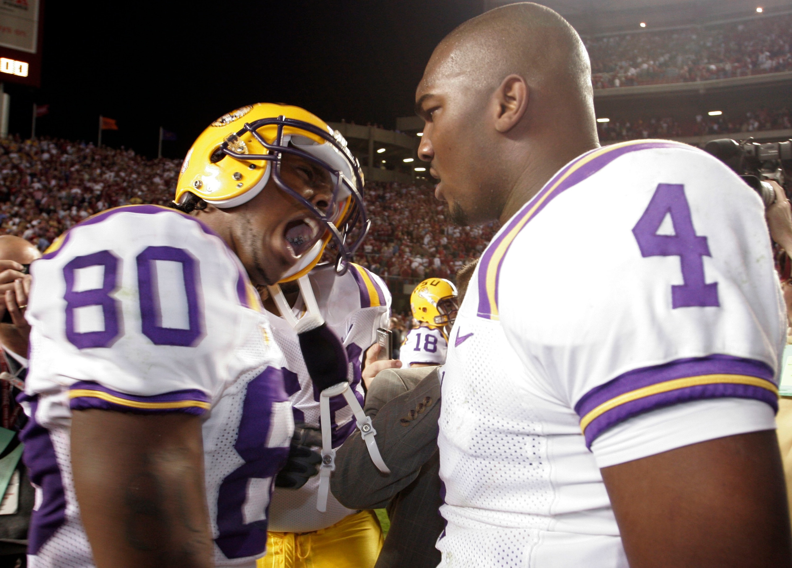 TUSCALOOSA, AL - NOVEMBER 12:  Dwayne Bowe #80 (L) of Louisiana State University  celebrates his game winning touchdown in overtime with Quarterback JaMarcus Russell #4 against the University of Alabama on November 12, 2005 at at Bryant-Denny Stadium in T