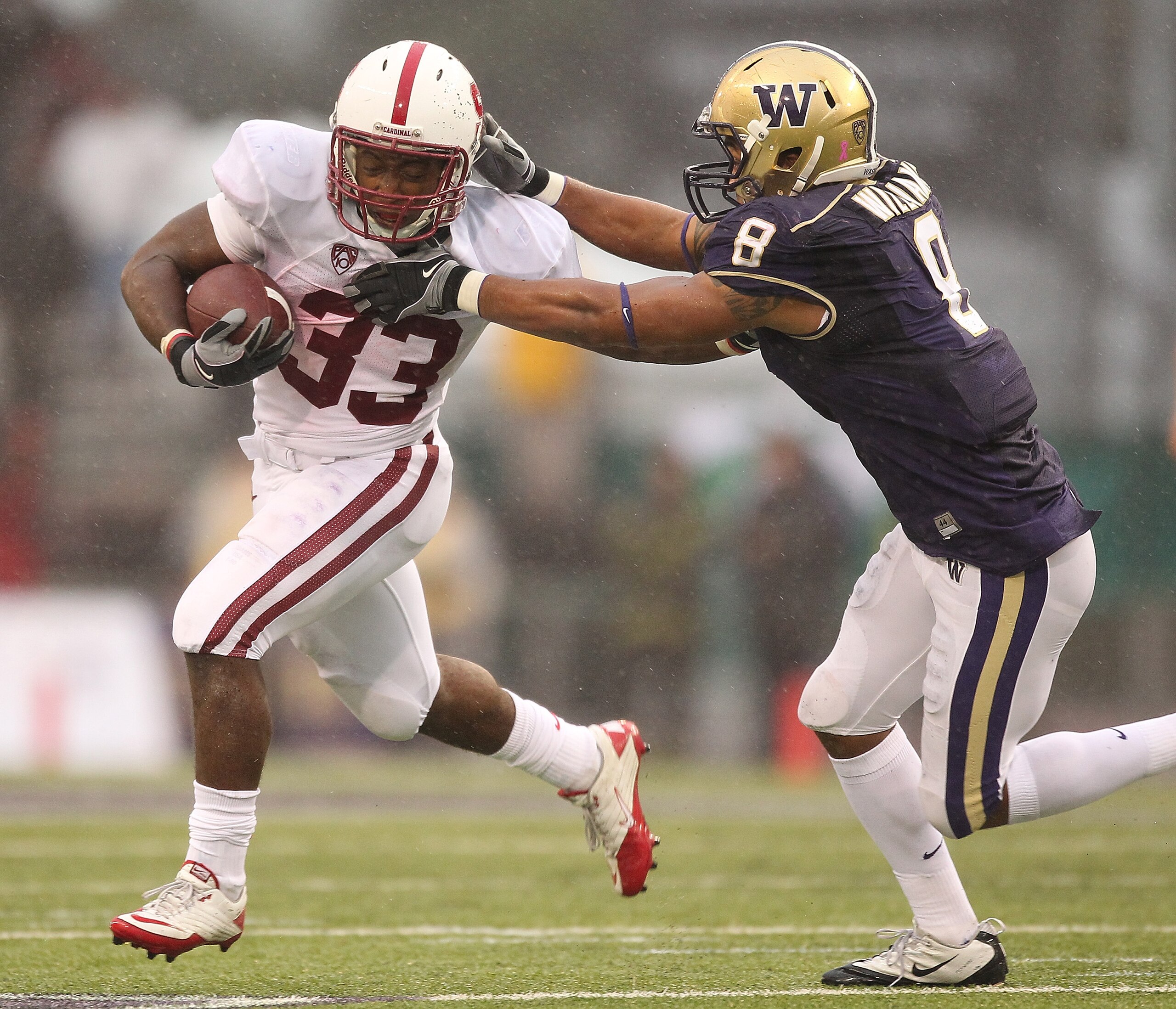 SEATTLE - OCTOBER 30:  Running back Stepfan Taylor #33 of the Stanford Cardinal rushes against Nate Williams #8 of the Washington Huskies on October 30, 2010 at Husky Stadium in Seattle, Washington. Stanford defeated Washington 41-0. (Photo by Otto Greule