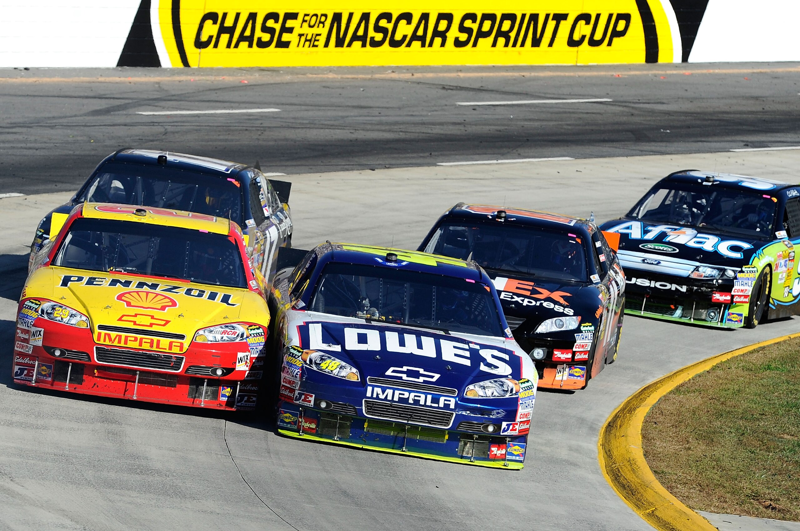 MARTINSVILLE, VA - OCTOBER 24: Kevin Harvick, driver of the #29 Shell/Pennzoil Chevrolet, races Jimmie Johnson, driver of the #48 Lowe's Chevrolet, during the NASCAR Sprint Cup Series TUMS Fast Relief 500 at Martinsville Speedway on October 24, 2010 in M MARTINSVILLE, VA - OCTOBER 24: Kevin Harvick, driver of the #29 Shell/Pennzoil Chevrolet, races Jimmie Johnson, driver of the #48 Lowe's Chevrolet, during the NASCAR Sprint Cup Series TUMS Fast Relief 500 at Martinsville Speedway on October 24, 2010 in M