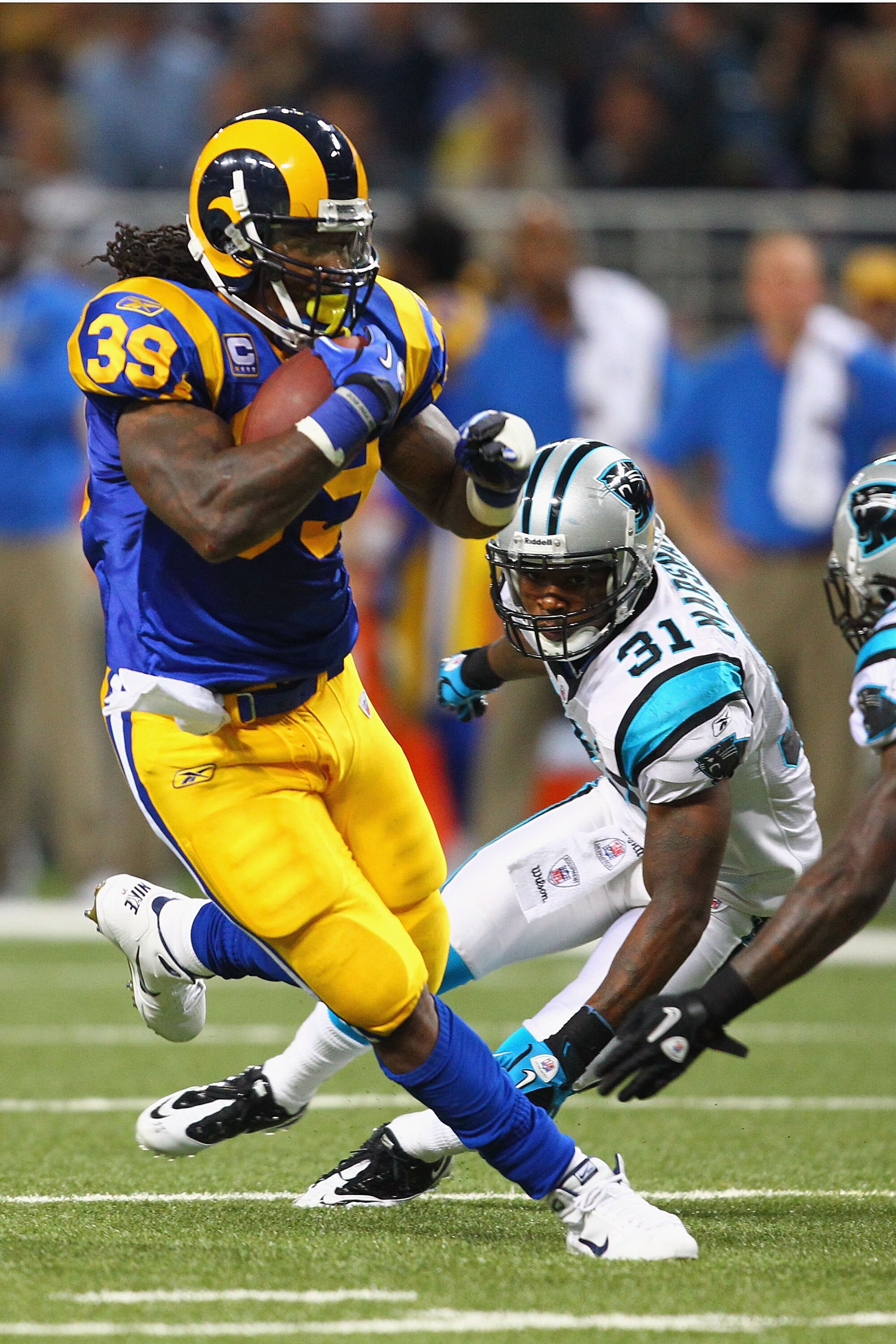 ST. LOUIS - OCTOBER 31: Steven Jackson #39 of the St. Louis Rams rushes past Richard Marshall #31 of the Carolina Panthers at the Edward Jones Dome on October 31, 2010 in St. Louis, Missouri.  The Rams beat the Panthers 20-10.  (Photo by Dilip Vishwanat/G