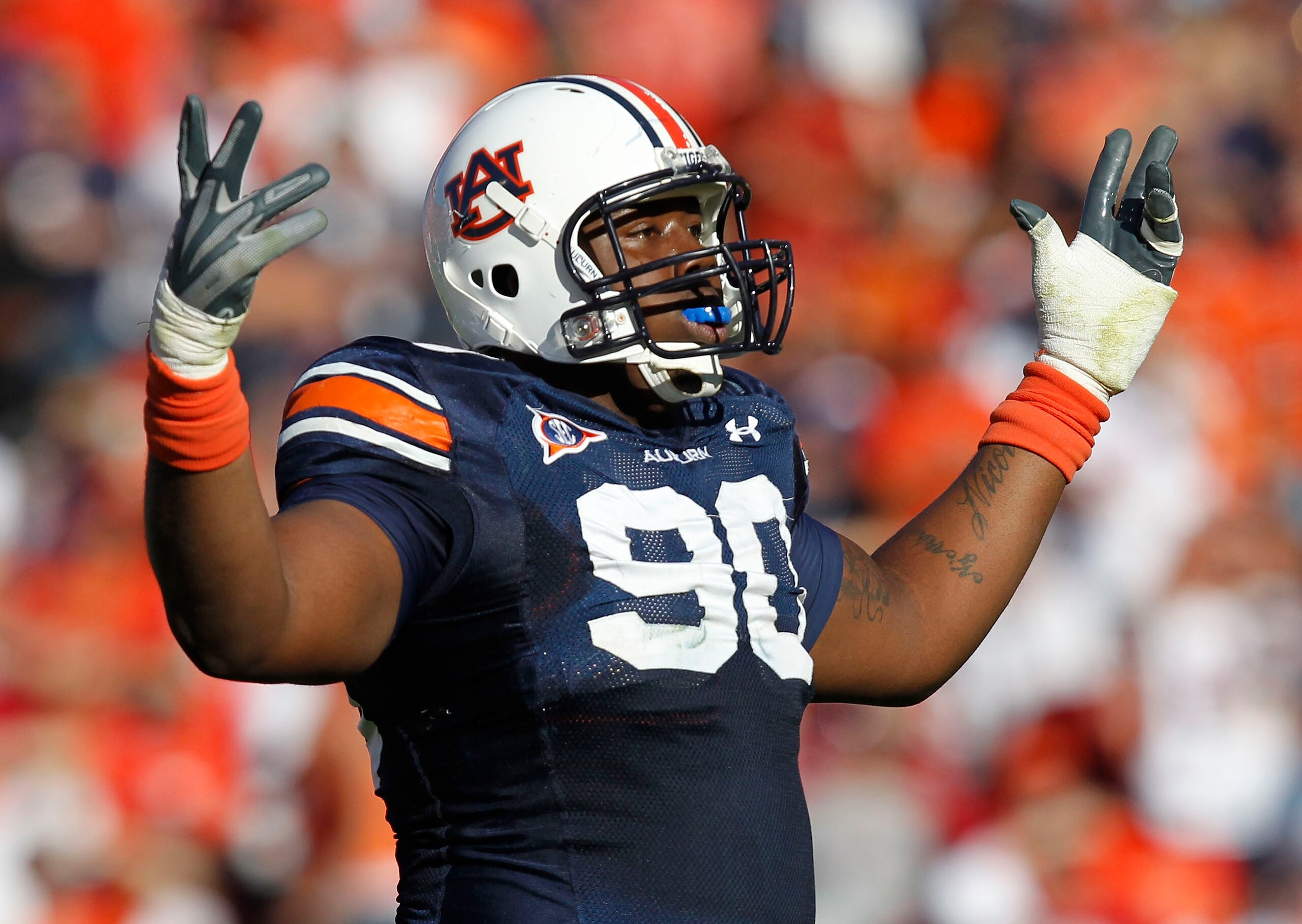 AUBURN, AL - OCTOBER 16: Defensive lineman Nick Fairley #90 of the Auburn Tigers celebrates a play during the game against the Arkansas Razorbacks at Jordan-Hare Stadium on October 16, 2010 in Auburn, Alabama. (Photo by Mike Zarrilli/Getty Images) AUBURN, AL - OCTOBER 16: Defensive lineman Nick Fairley #90 of the Auburn Tigers celebrates a play during the game against the Arkansas Razorbacks at Jordan-Hare Stadium on October 16, 2010 in Auburn, Alabama. (Photo by Mike Zarrilli/Getty Images)