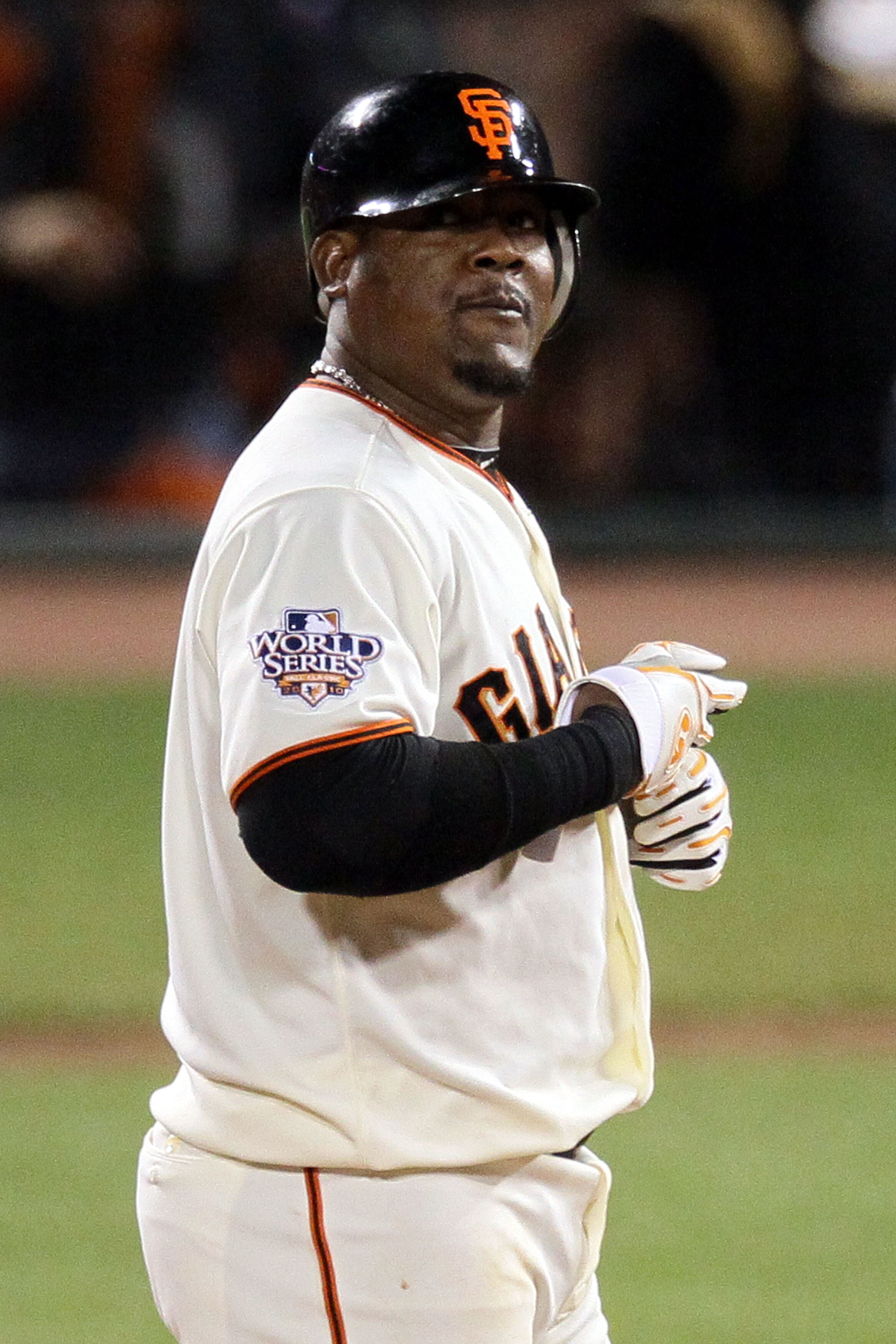 SAN FRANCISCO - OCTOBER 28:  Juan Uribe #5 of the San Francisco Giants reacts after hits a RBI double in the seventh inning off Darren Oliver #28 of the Texas Rangers in Game Two of the 2010 MLB World Series at AT&T Park on October 28, 2010 in San Francis