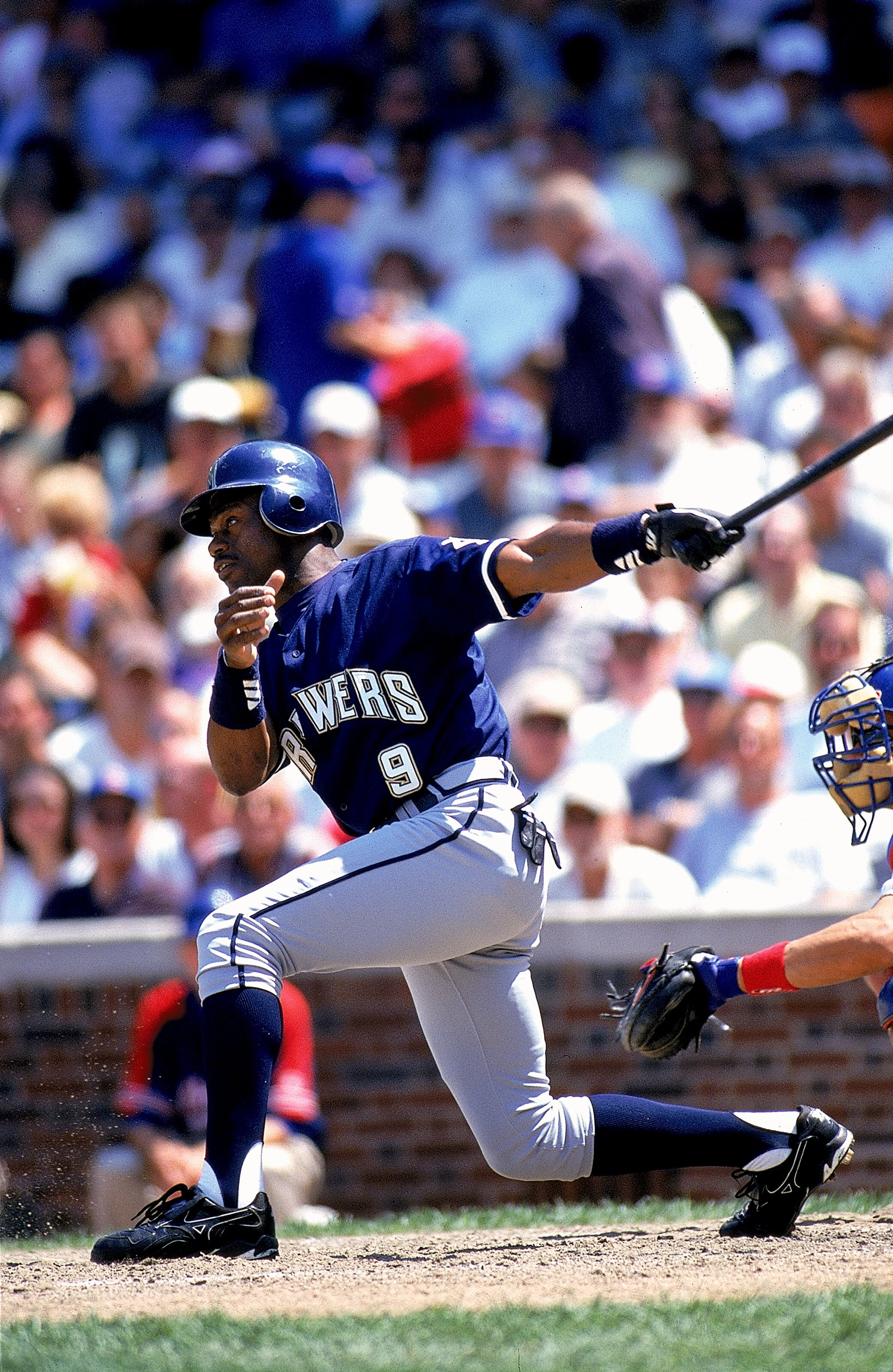 30 Jun 1999: Marquis Grissom #9 of the Milwaukee Brewers swings the bat during the game against the Chicago Cubs at Wrigley Field in Chicago, Illinois. The Cubs defeated the Brewers 5-4.