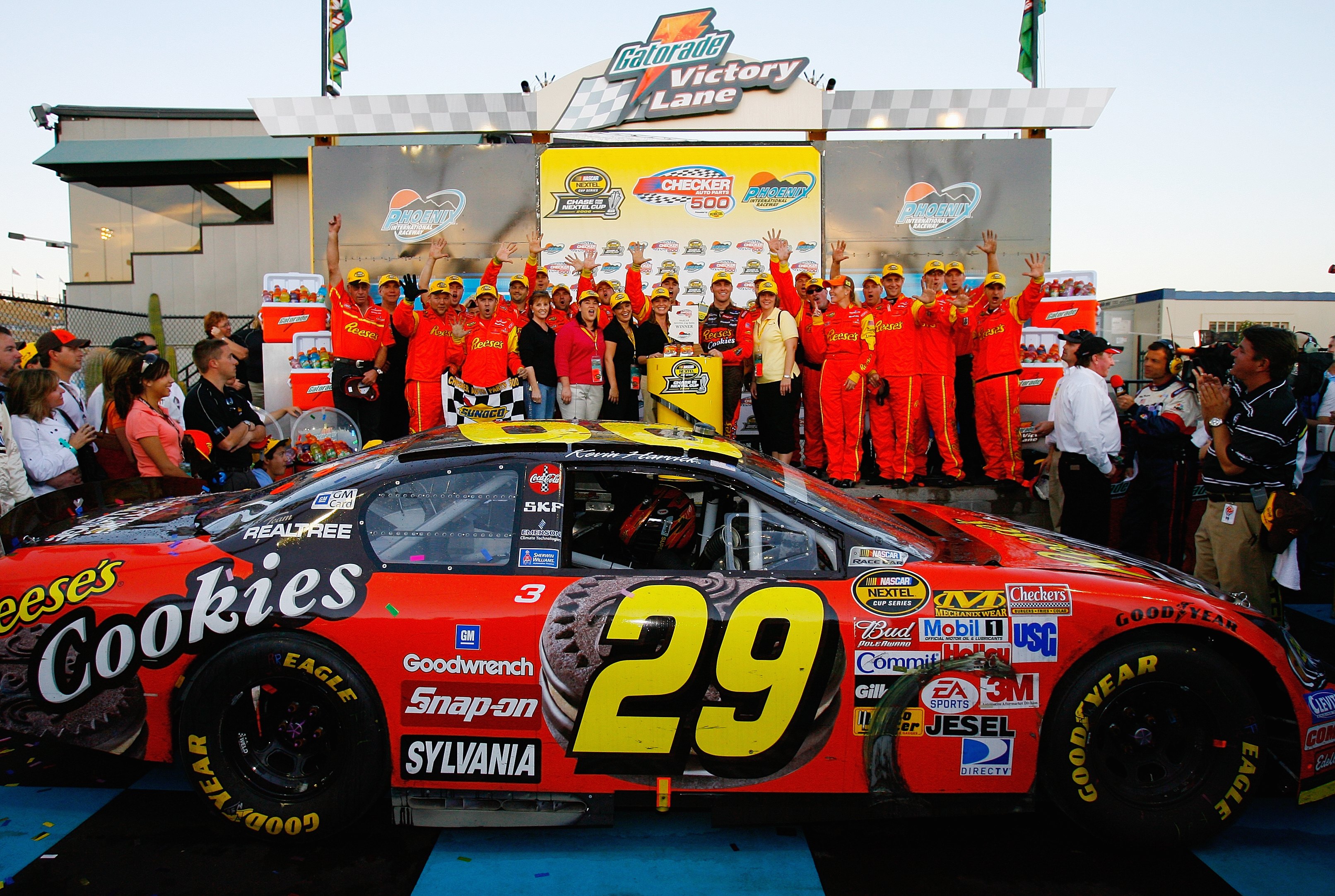 AVONDALE, AZ - NOVEMBER 12: Kevin Harvick, driver of the #29 Reese's Cookies Chevrolet, celebrates in victory lane with team members and guests after winning the NASCAR Nextel Cup Series Checker Auto Parts 500, on November 12, 2006 at Phoenix Internationa