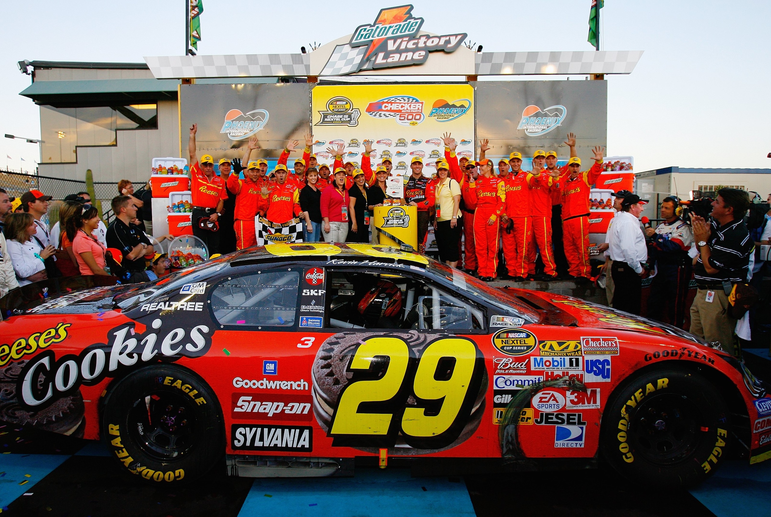 AVONDALE, AZ - NOVEMBER 12: Kevin Harvick, driver of the #29 Reese's Cookies Chevrolet, celebrates in victory lane with team members and guests after winning the NASCAR Nextel Cup Series Checker Auto Parts 500, on November 12, 2006 at Phoenix Internationa AVONDALE, AZ - NOVEMBER 12: Kevin Harvick, driver of the #29 Reese's Cookies Chevrolet, celebrates in victory lane with team members and guests after winning the NASCAR Nextel Cup Series Checker Auto Parts 500, on November 12, 2006 at Phoenix Internationa