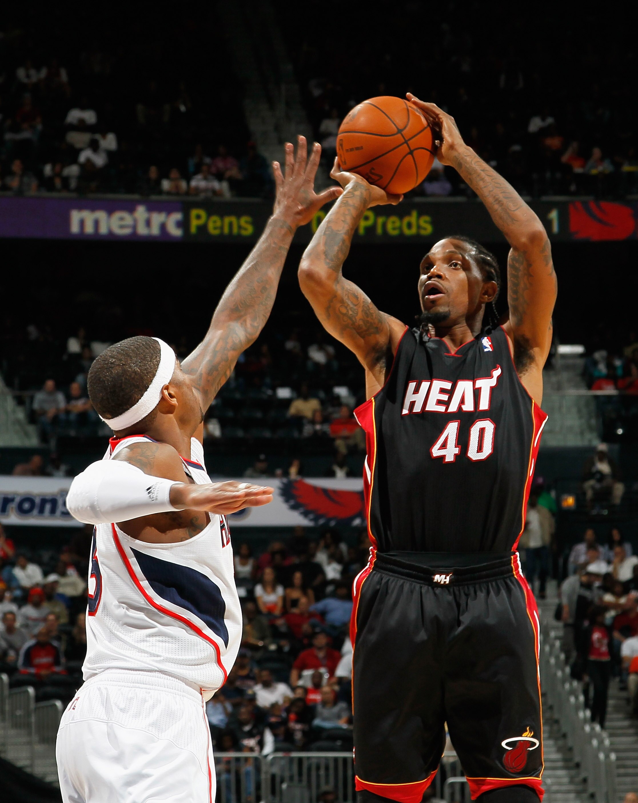 ATLANTA - OCTOBER 21:  Udonis Haslem #40 of the Miami Heat against Josh Smith #5 of the Atlanta Hawks at Philips Arena on October 21, 2010 in Atlanta, Georgia.  (Photo by Kevin C. Cox/Getty Images)