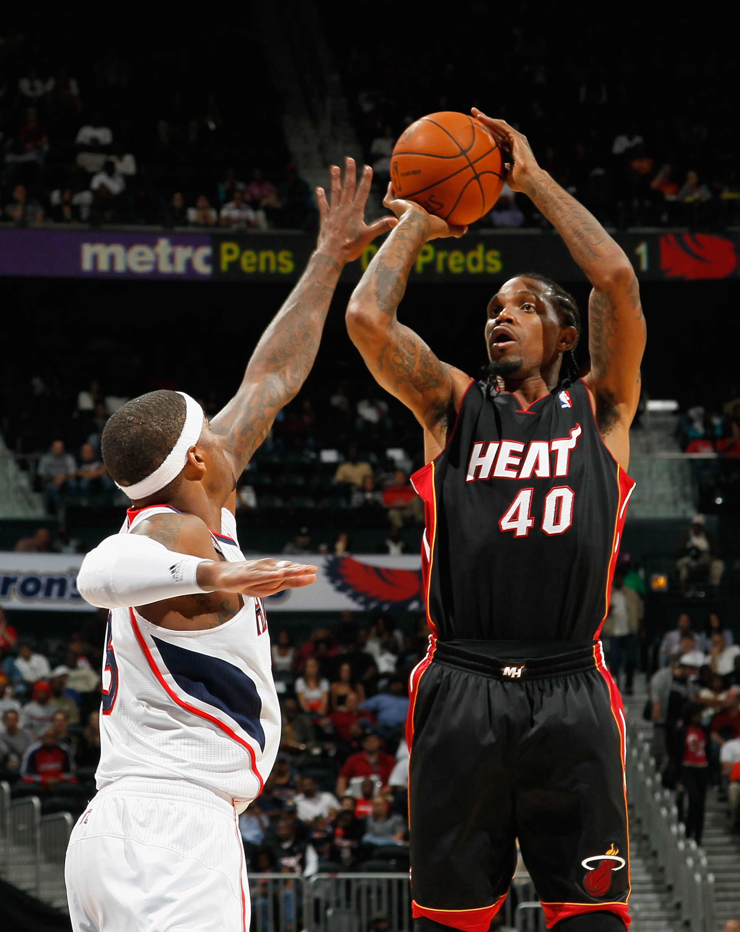 ATLANTA - OCTOBER 21:  Udonis Haslem #40 of the Miami Heat against Josh Smith #5 of the Atlanta Hawks at Philips Arena on October 21, 2010 in Atlanta, Georgia.  (Photo by Kevin C. Cox/Getty Images)