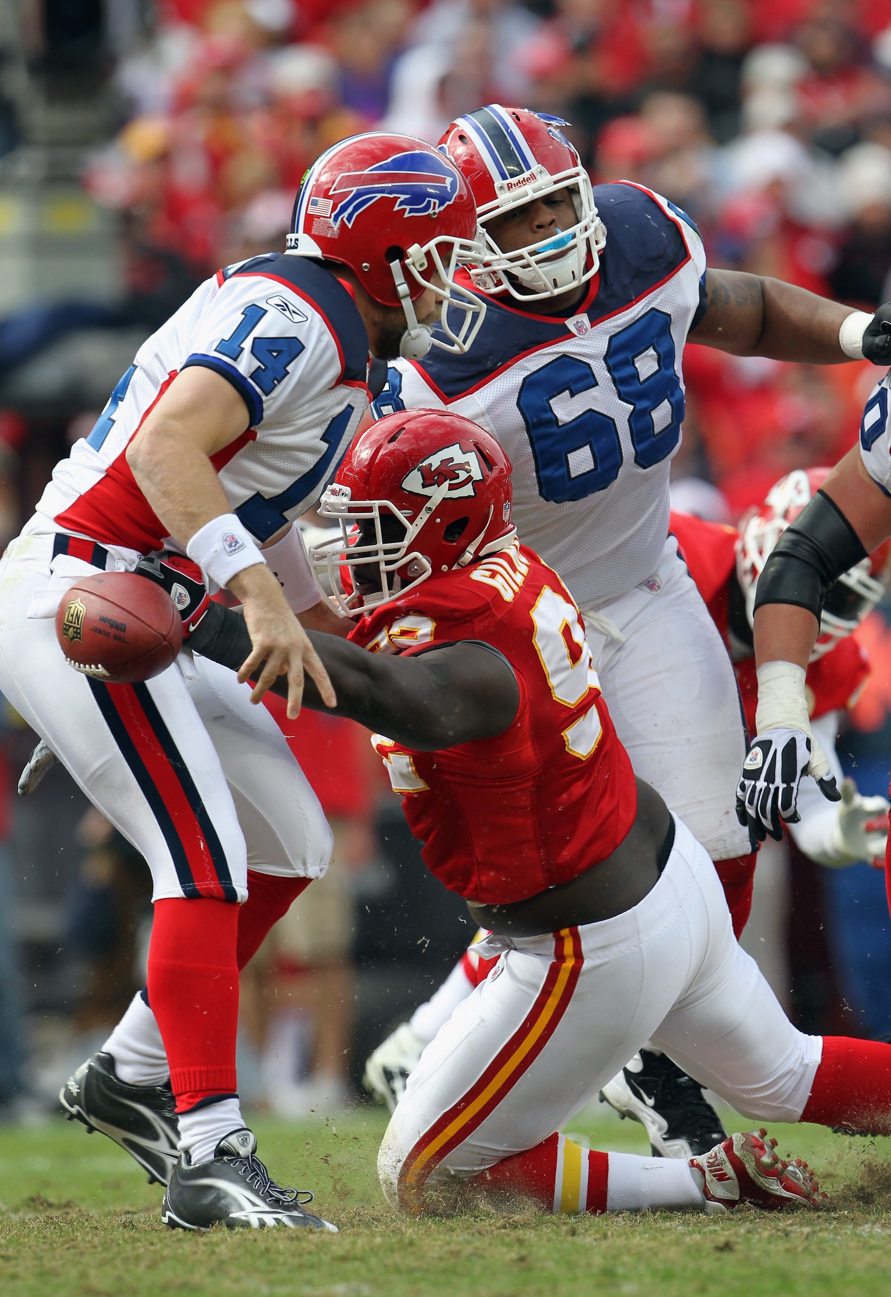 KANSAS CITY, MO - OCTOBER 31:  Wallace Gilberry #92 of the Kansas City Chiefs strips the ball from the hands of quarterback Ryan Fitzpatrick #14 of the Buffalo Bills during the game on October 31, 2010  at Arrowhead Stadium in Kansas City, Missouri.  (Pho