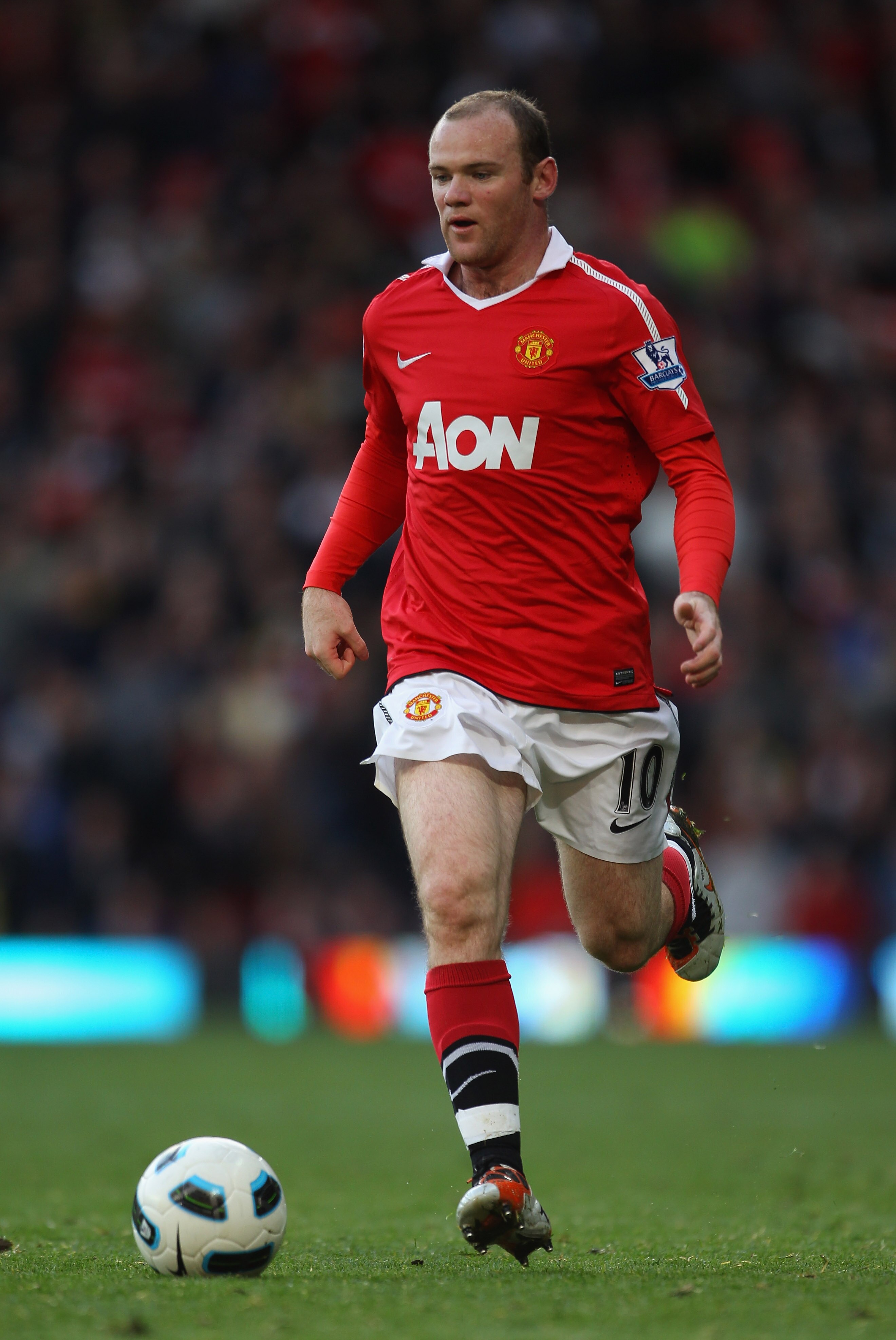 MANCHESTER, ENGLAND - OCTOBER 16:  Wayne Rooney of Manchester United runs with the ball during the Barclays Premier League match between Manchester United and West Bromwich Albion at Old Trafford on October 16, 2010 in Manchester, England.  (Photo by Alex