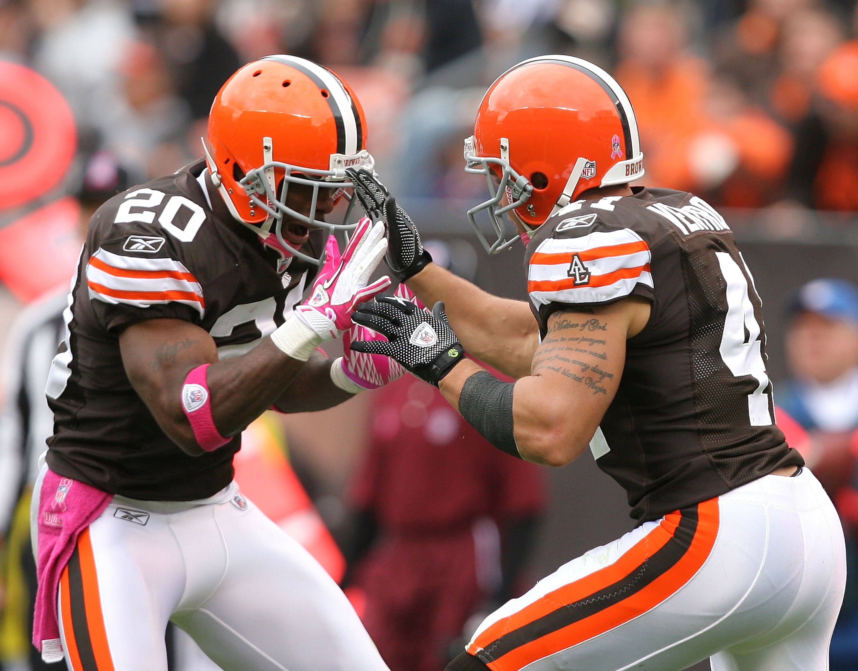 CLEVELAND - OCTOBER 03:  Defensive back Mike Adams #20 and Ray Ventrone #41 of the Cleveland Browns celebrate after a play against the Cincinnati Bengals at Cleveland Browns Stadium on October 3, 2010 in Cleveland, Ohio.  (Photo by Matt Sullivan/Getty Ima