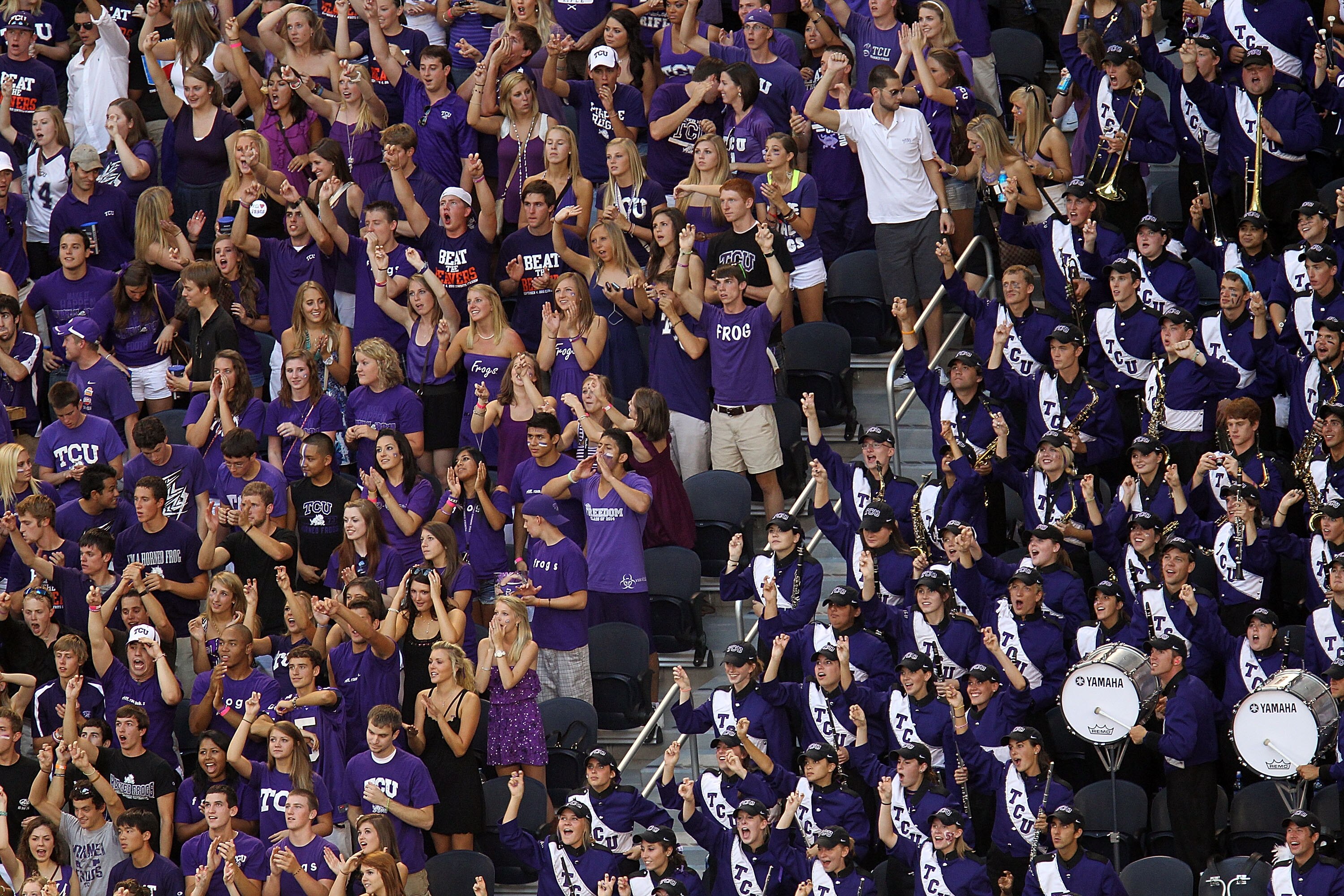 ARLINGTON, TX - SEPTEMBER 04:  Fans of the TCU Horned Frogs cheer during play against the Oregon State Beavers at Cowboys Stadium on September 4, 2010 in Arlington, Texas.  (Photo by Ronald Martinez/Getty Images)