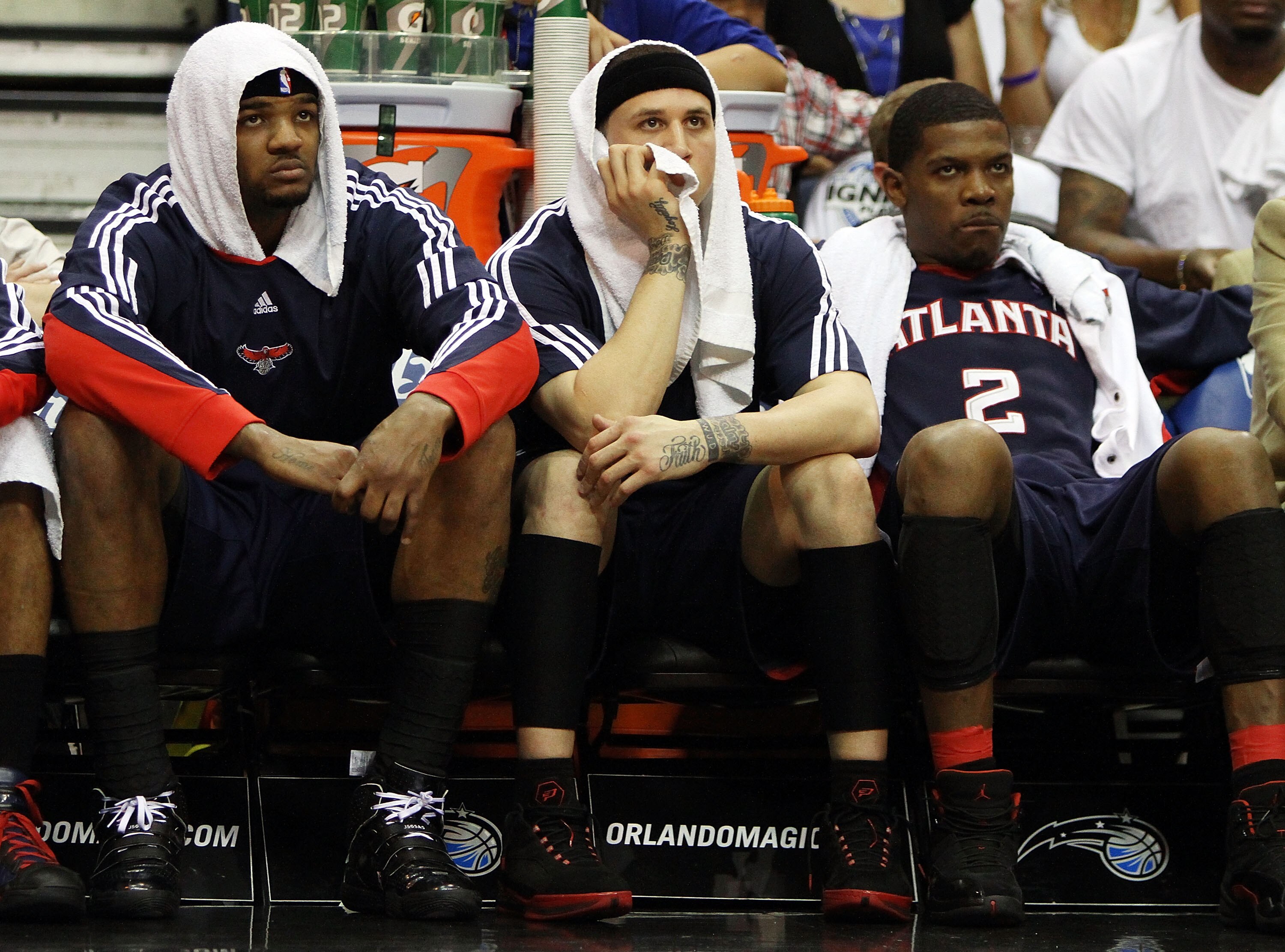 ORLANDO, FL - MAY 04:  (L to R) Josh Smith #5, Mike Bibby #10 and Joe Johnson #2 of the Atlanta Hawks sit on the bench and watch the fourth quarter against the Orlando Magic in Game One of the Eastern Conference Semifinals during the 2010 NBA Playoffs at