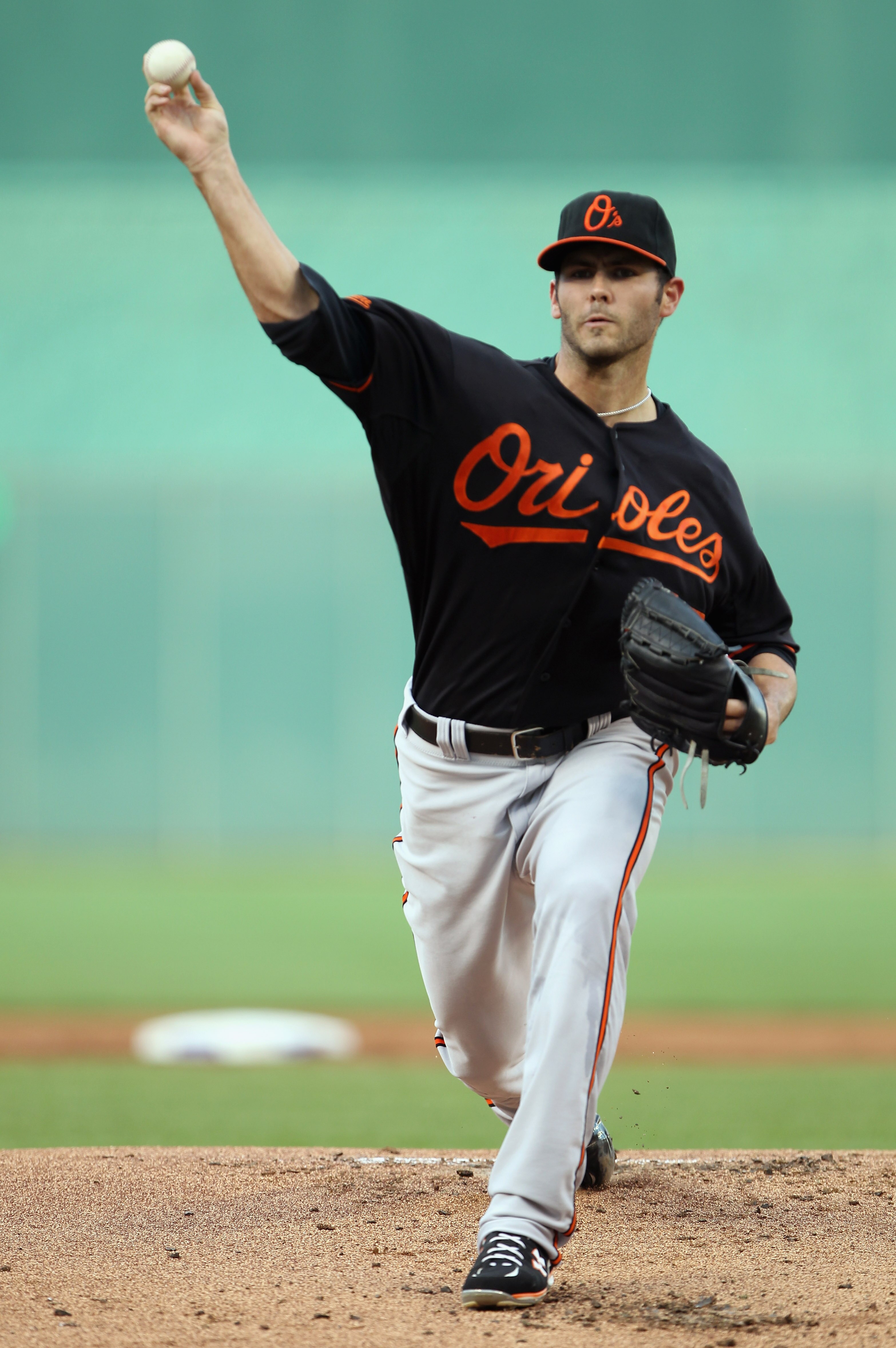 KANSAS CITY, MO - JULY 30:  Starting pitcher Jake Arrieta #57 of the Baltimore Orioles warms-up just prior to the start of the game against the Kansas City Royals on July 30, 2010 at Kauffman Stadium in Kansas City, Missouri.  (Photo by Jamie Squire/Getty
