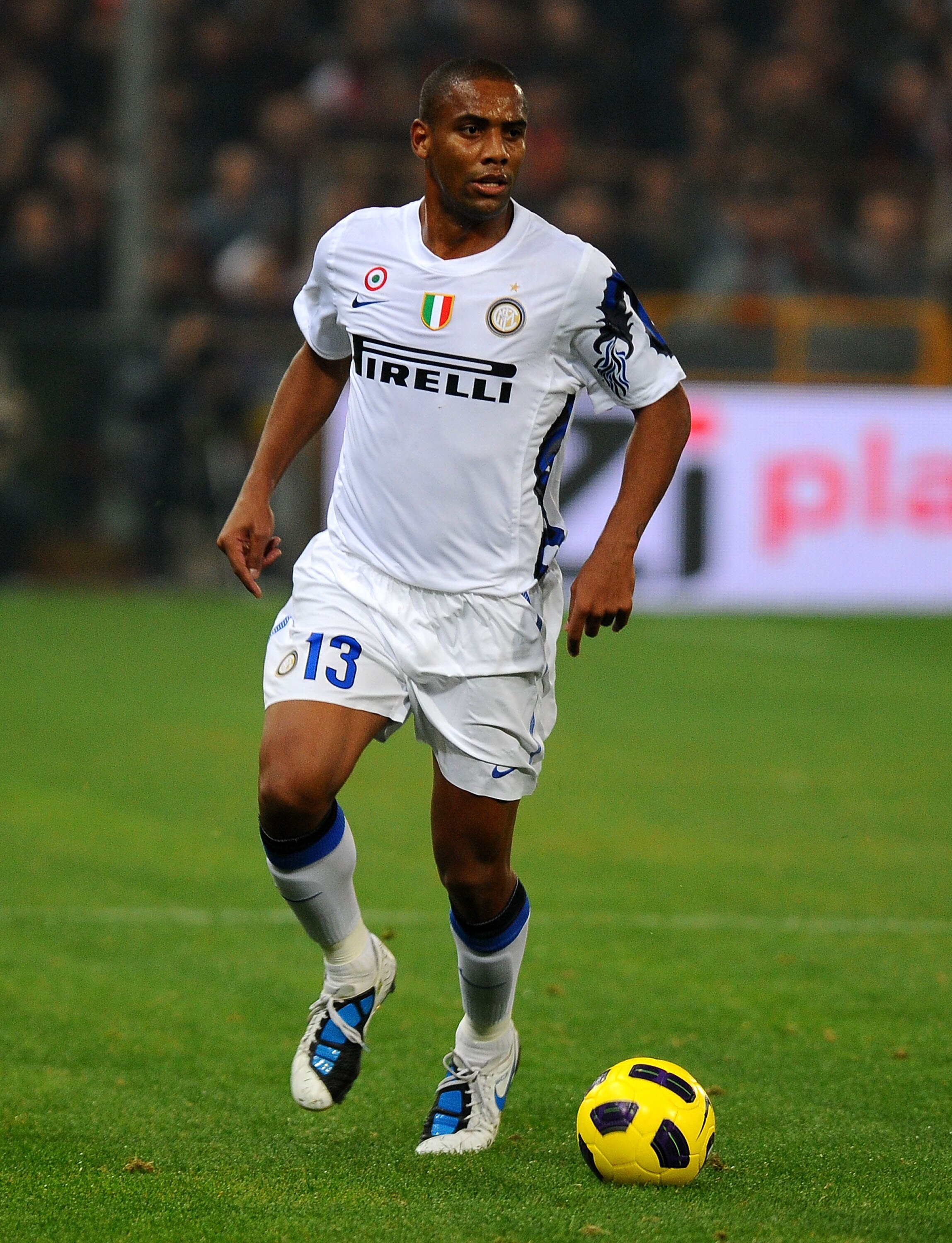 GENOA, ITALY - OCTOBER 29: Sisenando Maicon Douglas of FC Internazionale Milano runs with the ball  during the Serie A match between Genoa CFC and FC Inter Milan at Stadio Luigi Ferraris on October 29, 2010 in Genoa, Italy. (Photo by Massimo Cebrelli/Gett