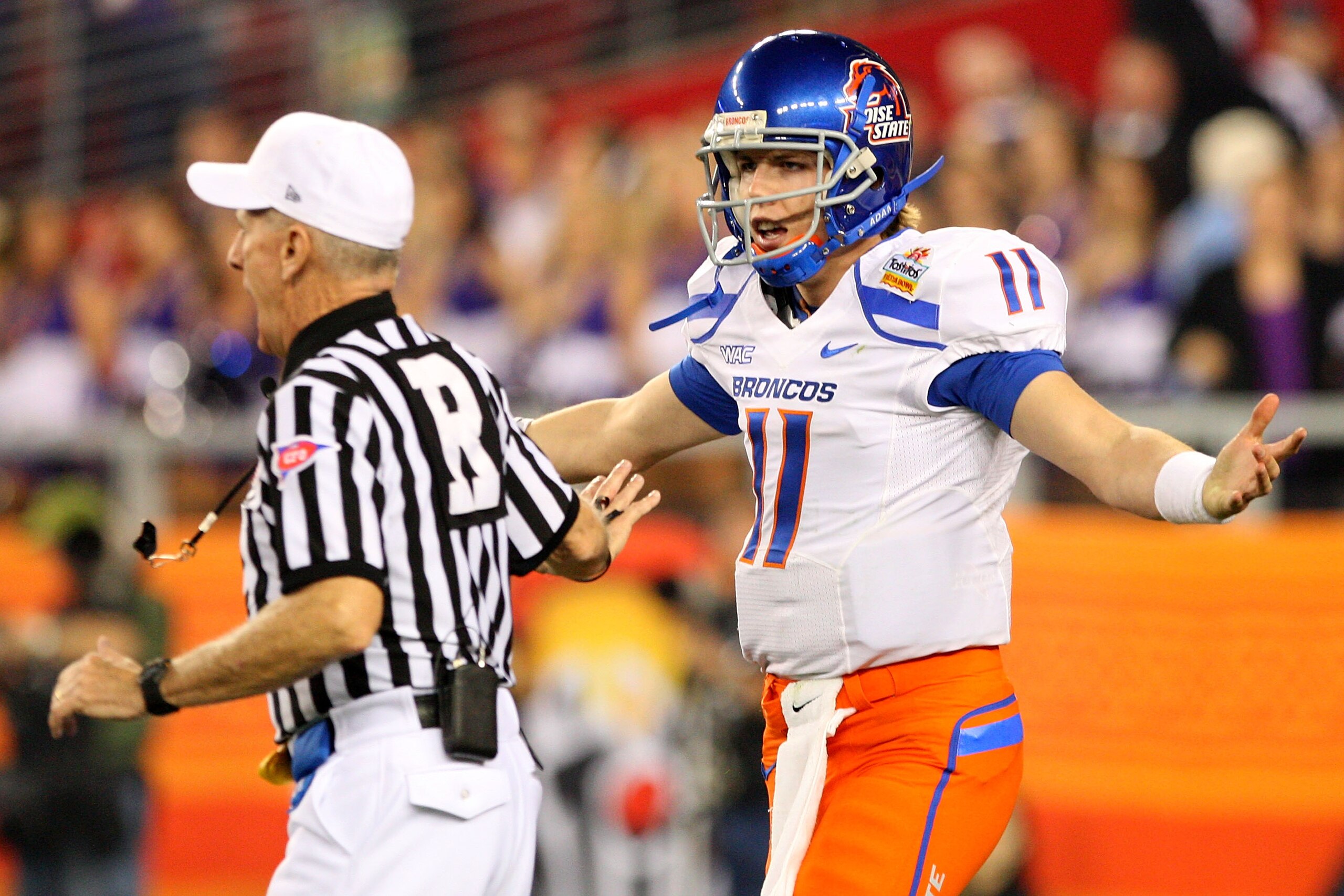 GLENDALE, AZ - JANUARY 04:  Quarterback Kellen Moore #11 of the Boise State Broncos argues with the referee in the first quarter against the TCU Horned Frogs during the Tostitos Fiesta Bowl at the Universtity of Phoenix Stadium on January 4, 2010 in Glend
