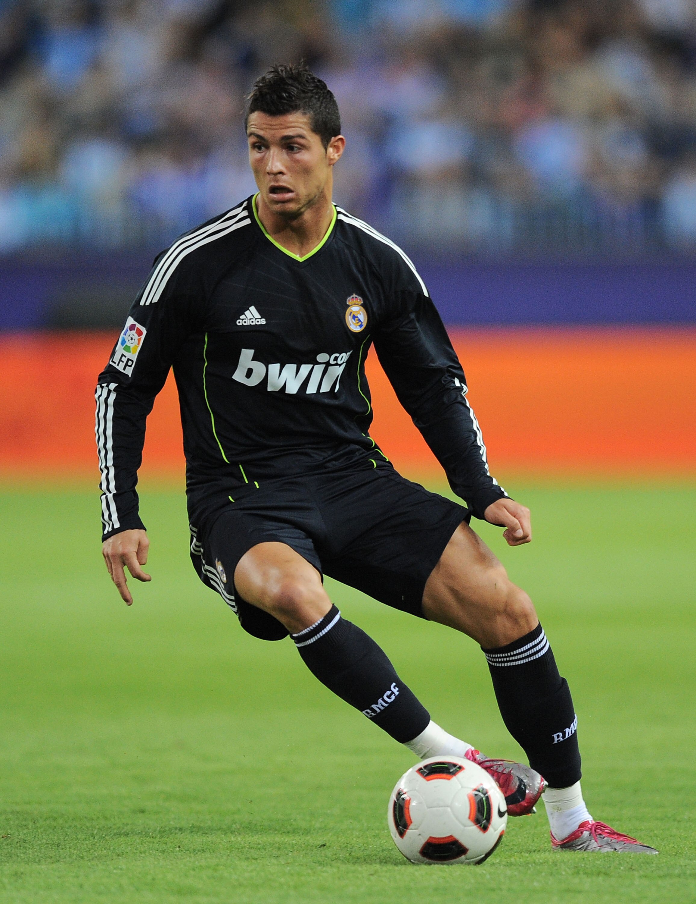 MALAGA, SPAIN - OCTOBER 16: Cristiano Ronaldo of Real Madrid dribbles during the La Liga match between Malaga and Real Madrid at La Rosaleda Stadium on October 16, 2010 in Malaga, Spain.  (Photo by Denis Doyle/Getty Images)