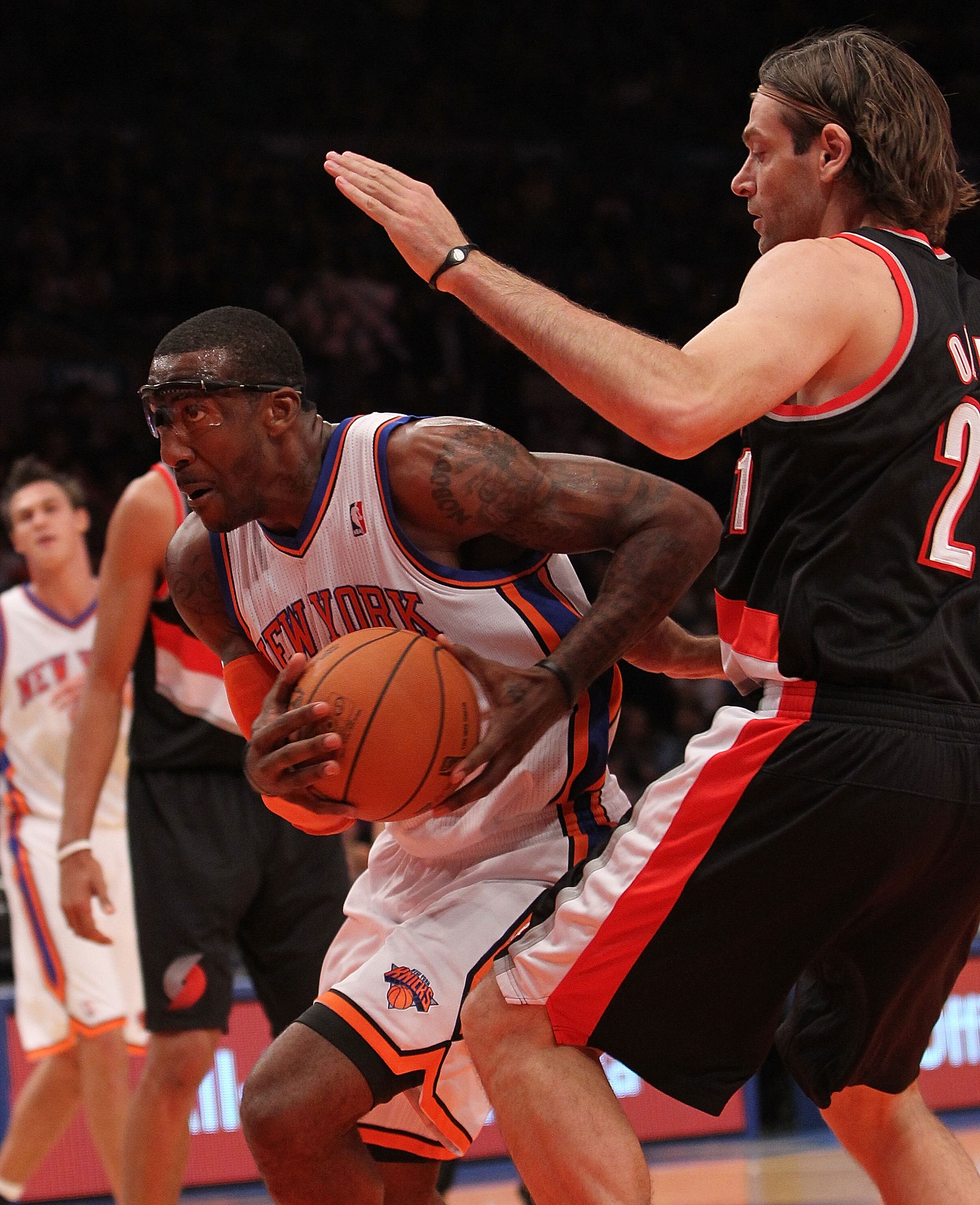 NEW YORK - OCTOBER 30:  Amar'e Stoudemire #1 of the New York Knicks drives against Fabricio Oberto #21 of the Portland Trail Blazers at Madison Square Garden on October 30, 2010 in New York City. NOTE TO USER: User expressly acknowledges and agrees that, 