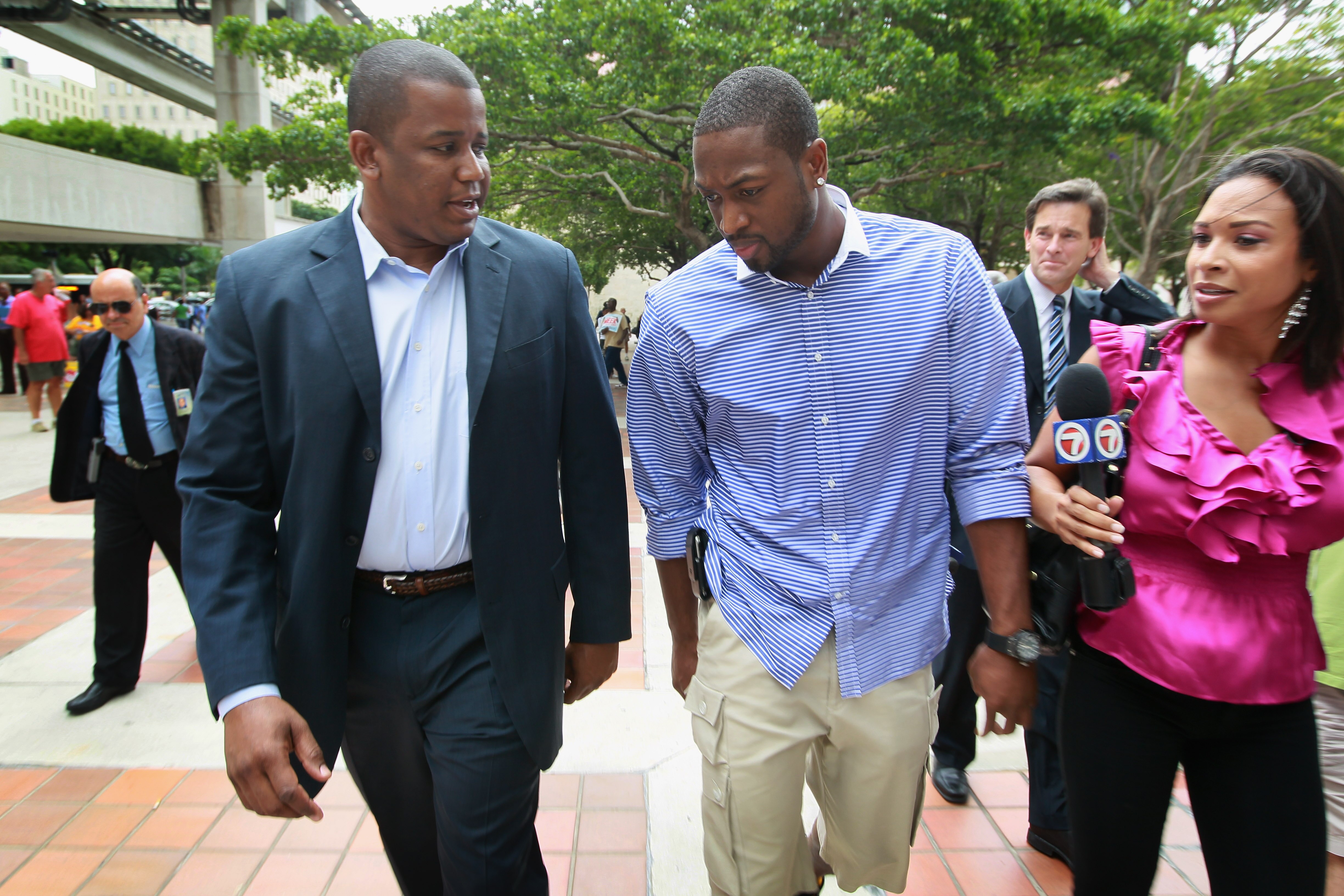 MIAMI - OCTOBER 28:  Democratic Senate candidate Rep. Kendrick Meek (D-FL) (L) walks with Miami Heat basketball player Dwyane Wade before Wade early voted October 28, 2010 in Miami, Florida. Wade threw his support behind Meek who is facing off against Rep