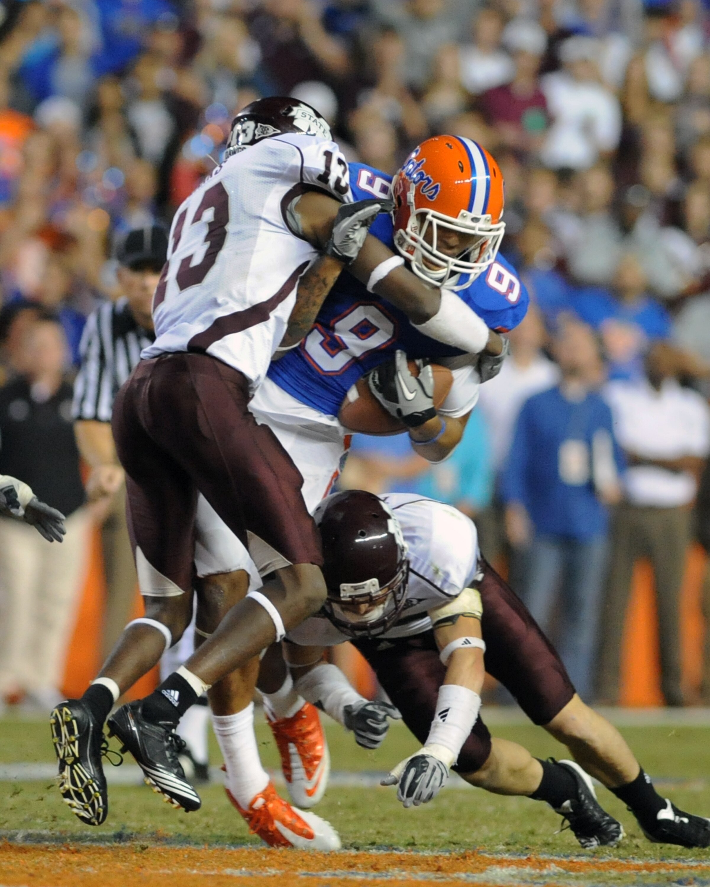 GAINESVILLE, FL - OCTOBER 16:  Wide receiver Carl Moore #9 of the Florida Gators grabs a mid-field pass against the Mississippi State Bulldogs October 16, 2010 Ben Hill Griffin Stadium at Gainesville, Florida.  (Photo by Al Messerschmidt/Getty Images)
