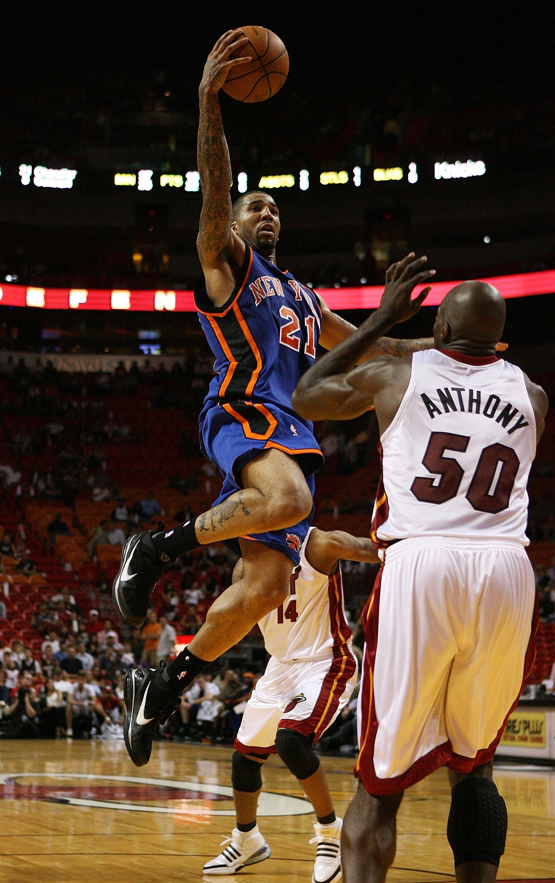 MIAMI - OCTOBER 28:  Wilson Chandler #21 of the New York Knicks shoots over Joel Anthony #50 of the Miami Heat at AmericanAirlines Arena on October 28, 2009 in Miami, Florida. The Heat defeated the Knicks 115-93. NOTE TO USER: User expressly acknowledges