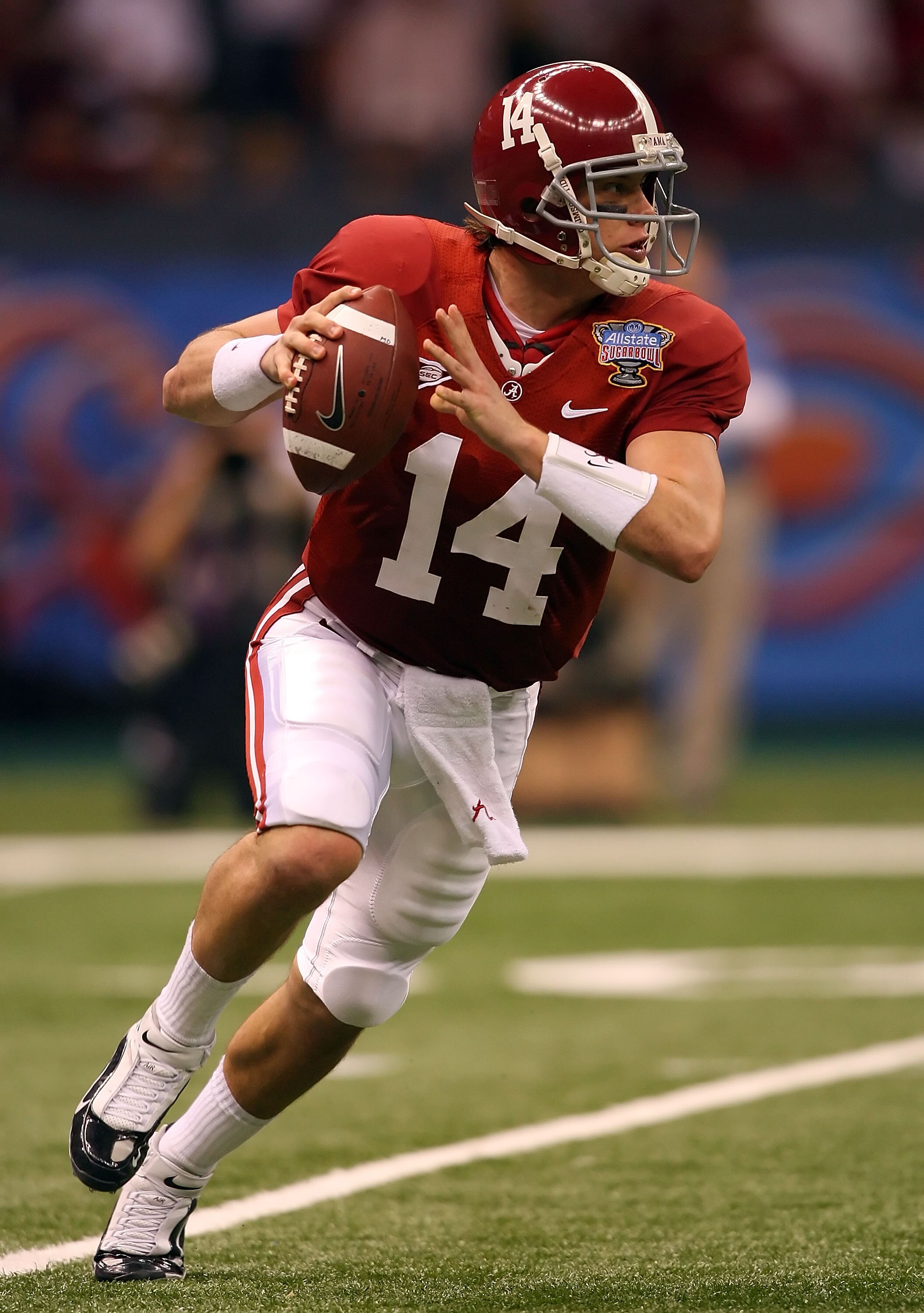 NEW ORLEANS - JANUARY 02:  Quarterback John Parker Wilson #14 of the Alabama Crimson Tide rolls out of the pocket in the second quarter while taking on the Utah Utes during the 75th Allstate Sugar Bowl at the Louisiana Superdome on January 2, 2009 in New