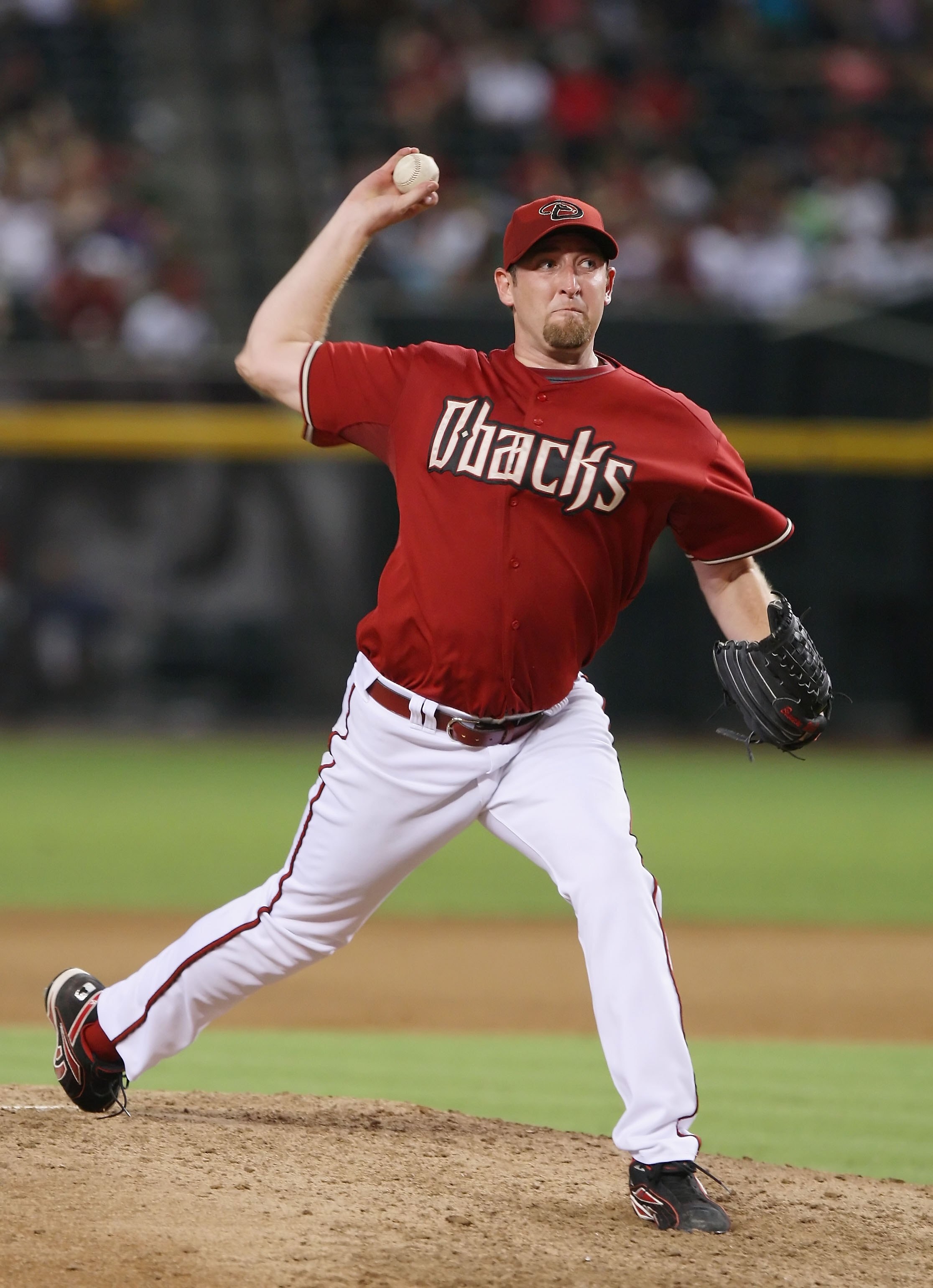 PHOENIX - AUGUST 05:  Brandon Webb #17 of the Arizona Diamondbacks pitches during the game against the Pittsburgh Pirates at Chase Field on August 5, 2008 in Phoenix, Arizona.  (Photo by Lisa Blumenfeld/Getty Images)