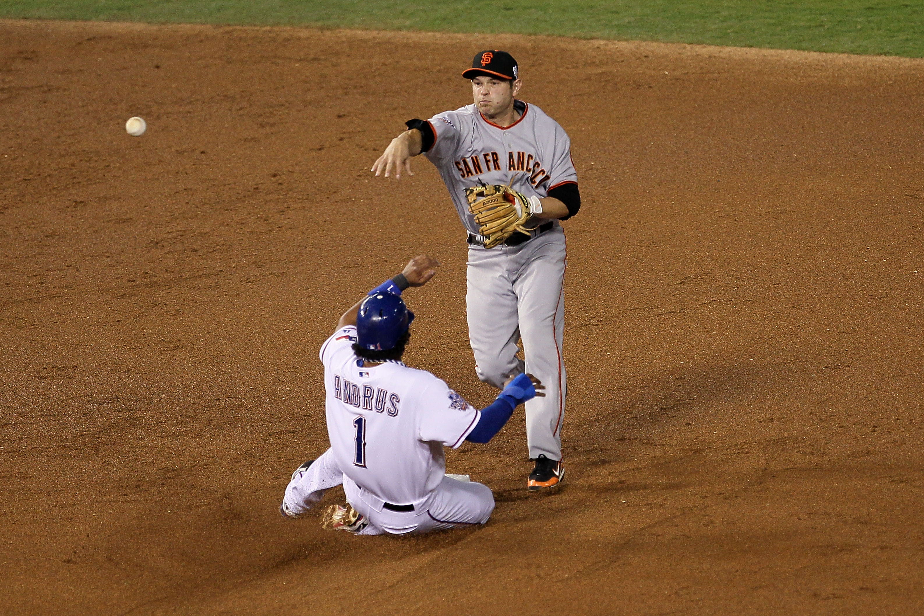 ARLINGTON, TX - OCTOBER 31:  Elvis Andrus #1 of the Texas Rangers is forced out at second base on a fielder's choice by Freddy Sanchez #21 of the San Francisco Giants in the top of the first inning of Game Four of the 2010 MLB World Series at Rangers Ball