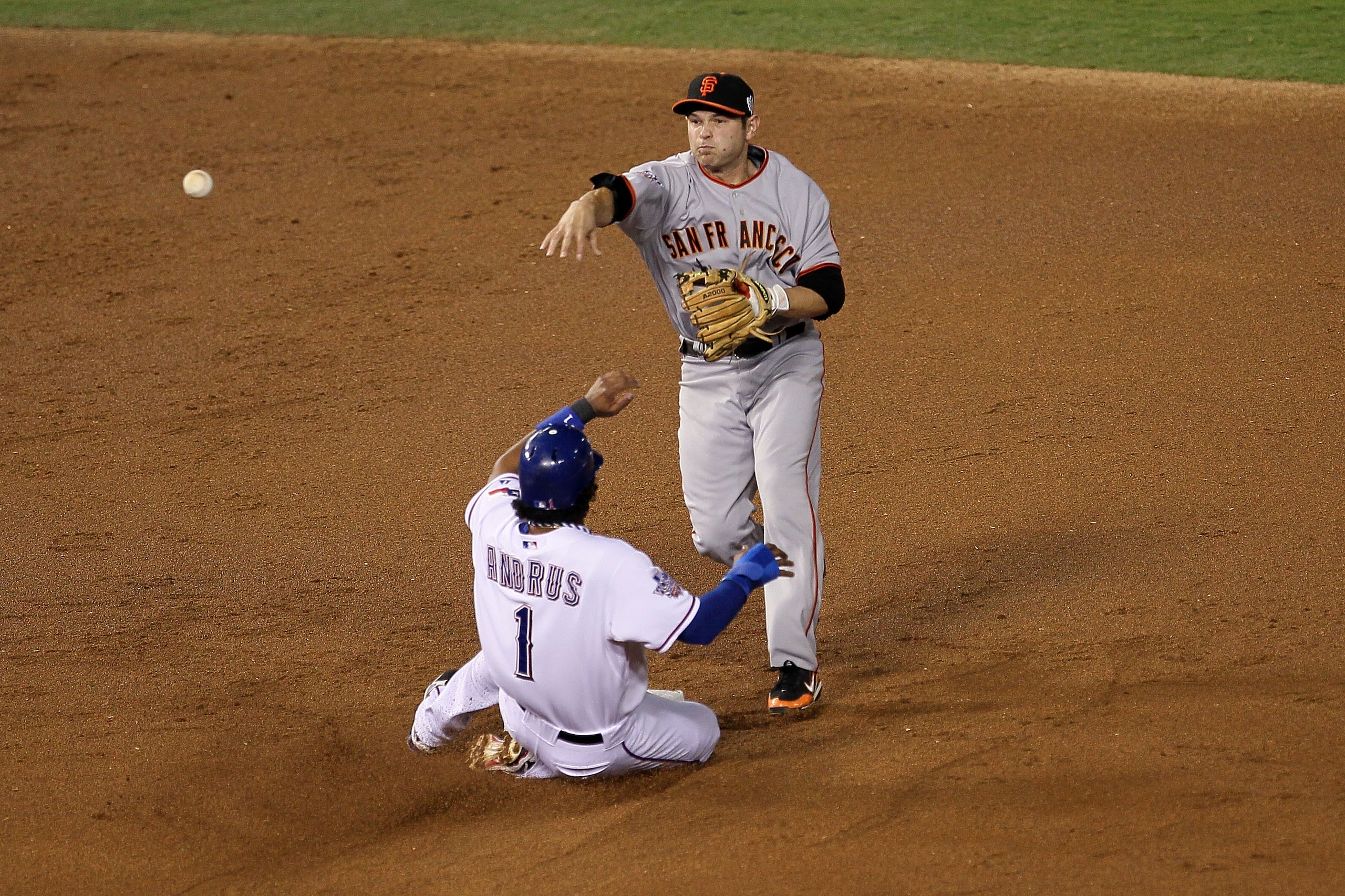 ARLINGTON, TX - OCTOBER 31:  Elvis Andrus #1 of the Texas Rangers is forced out at second base on a fielder's choice by Freddy Sanchez #21 of the San Francisco Giants in the top of the first inning of Game Four of the 2010 MLB World Series at Rangers Ball