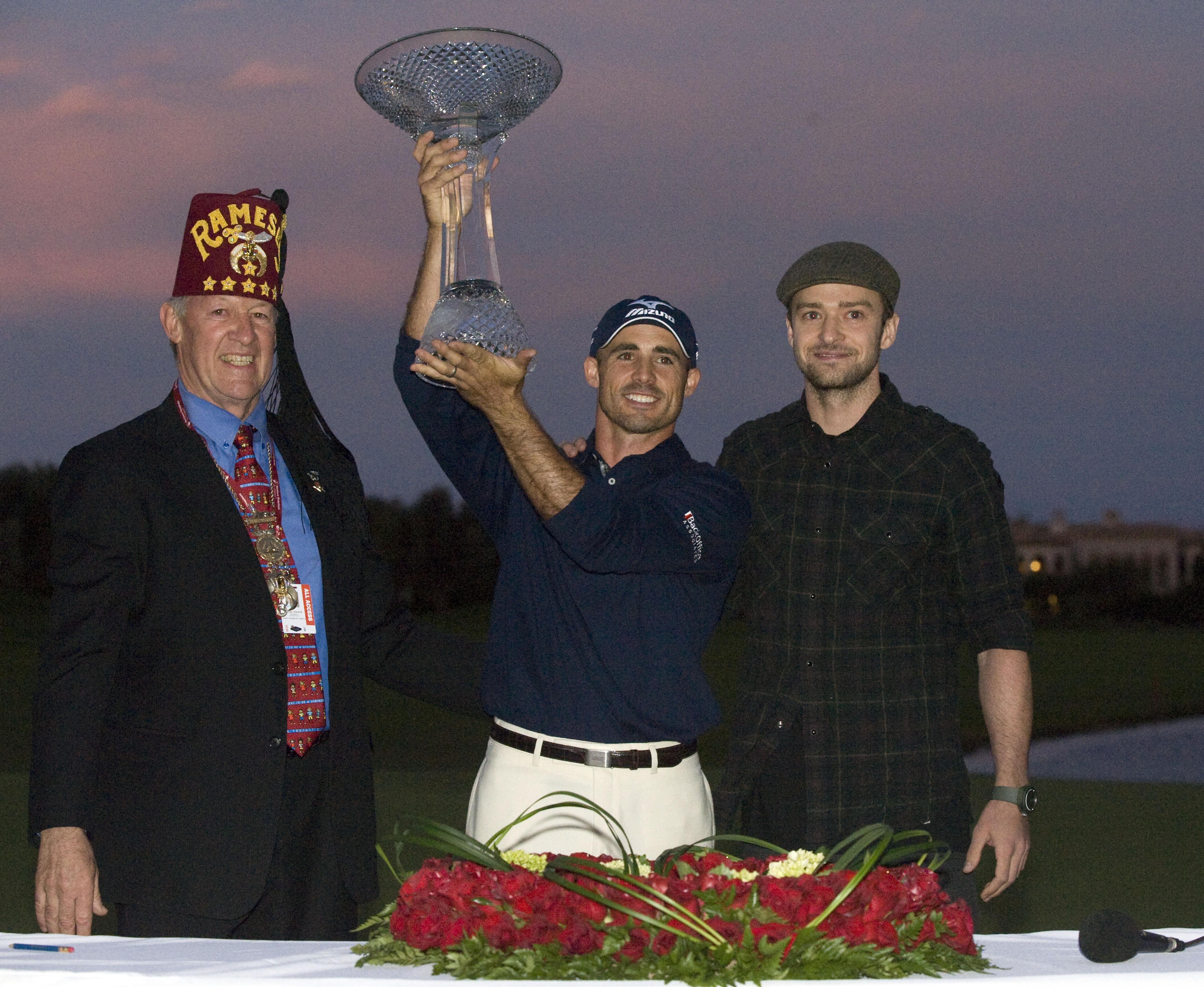 LAS VEGAS, NV - OCTOBER 24: (L - R) Shriner George Mitchell, golfer Jonathan Byrd and Justin Timberlake pose with the trophy after Byrd hit a hole-in-one to win the tournament at the Justin Timberlake Shriners Hospitals for Children Open at TPC Sunderlin