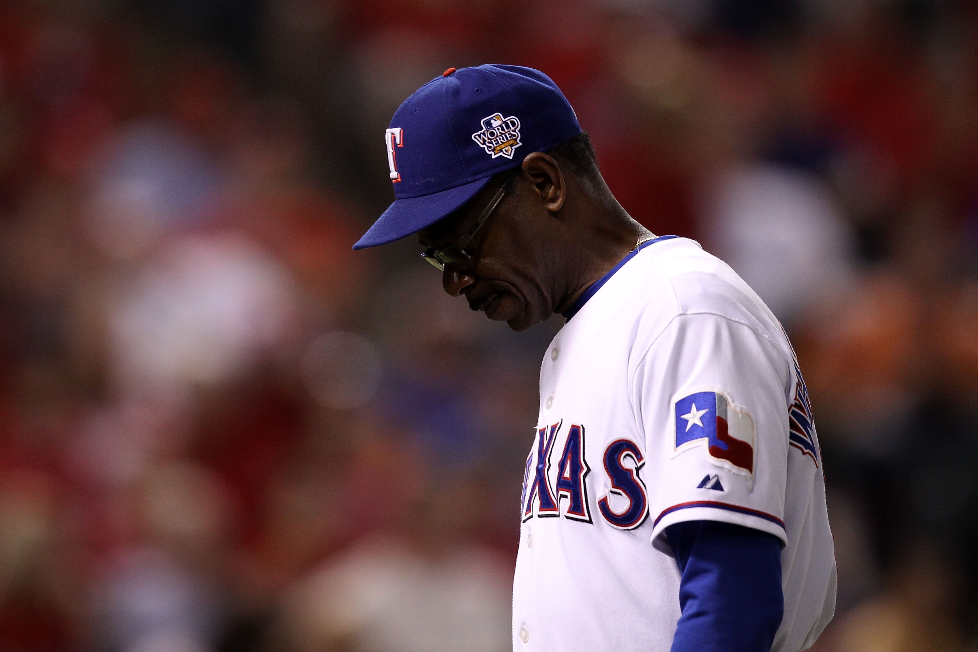 ARLINGTON, TX - OCTOBER 31:  Manager Ron Washington of the Texas Rangers walks back to the dugout with his head down late in the game against the San Francisco Giants in Game Four of the 2010 MLB World Series at Rangers Ballpark in Arlington on October 31