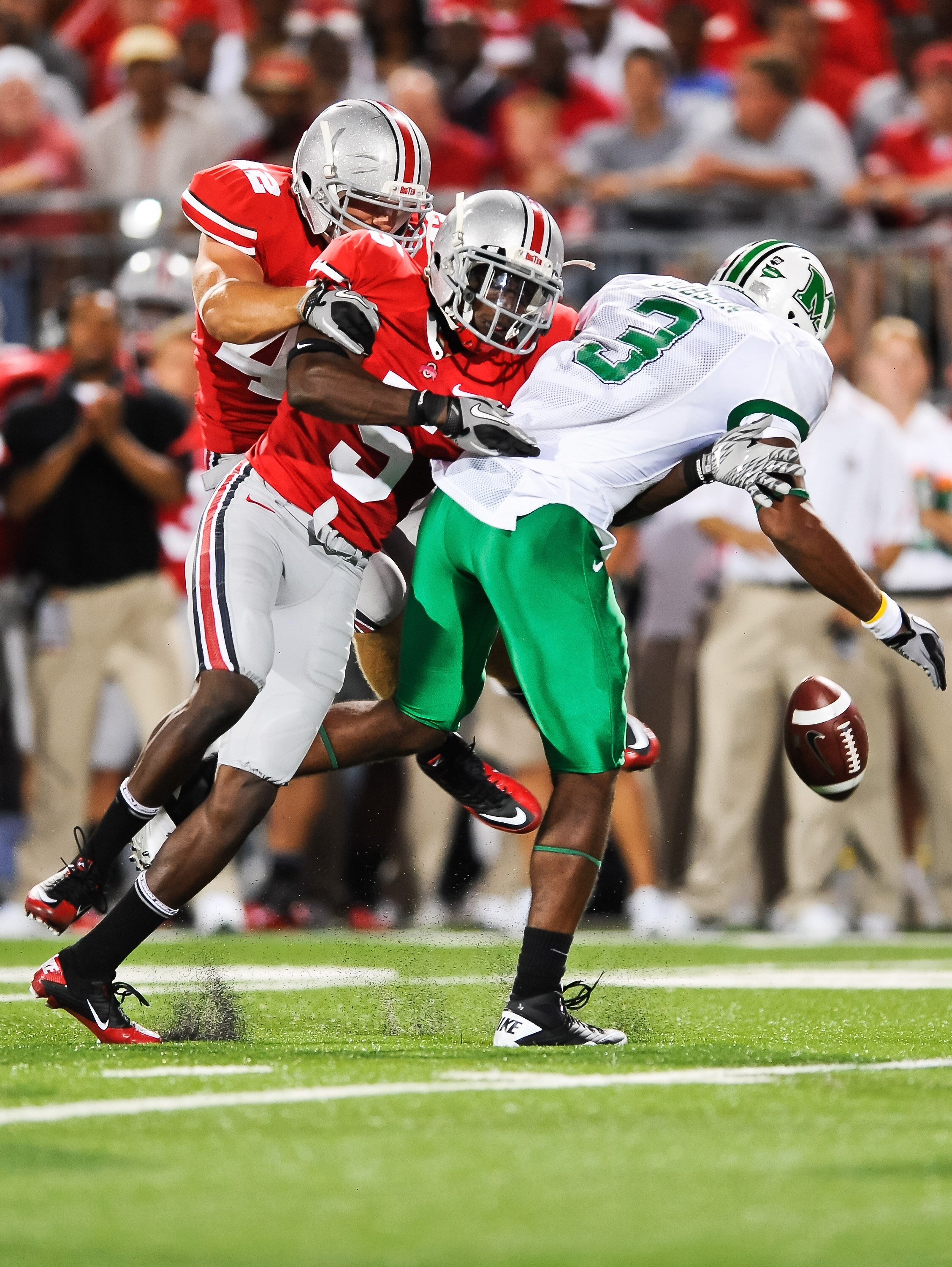 COLUMBUS, OH - SEPTEMBER 2: Chimdi Chekwa #5 of the Ohio State Buckeyes defends against Aaron Dobson #3 of the Marshall Thundering Herd at Ohio Stadium on September 2, 2010 in Columbus, Ohio. (Photo by Jamie Sabau/Getty Images)