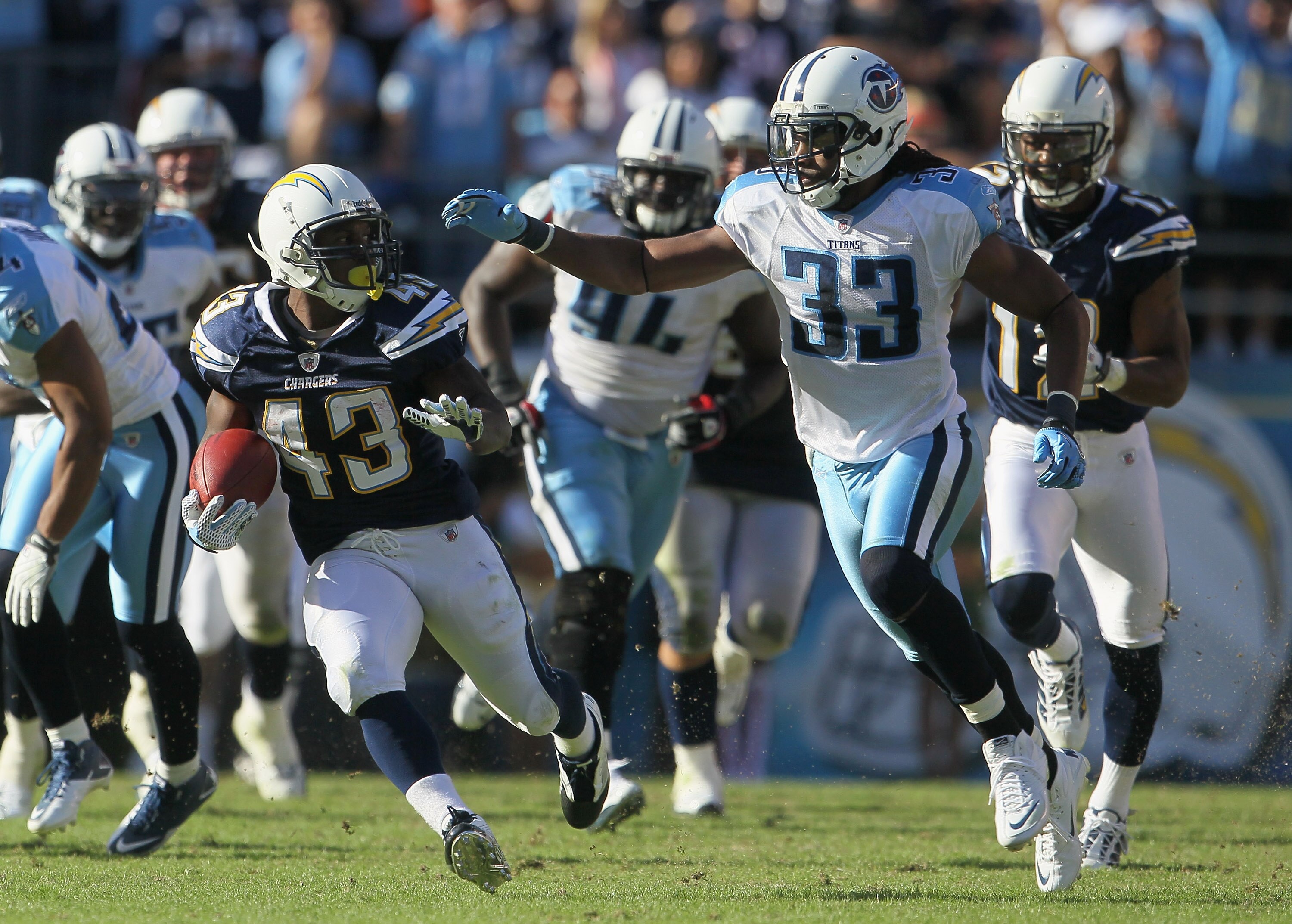 SAN DIEGO - OCTOBER 31:  Running back Darren Sproles #43 of the San Diego Chargers is pursued by Michael Griffin #33 of the Tennessee Titans in the third quarter at Qualcomm Stadium on October 31, 2010 in San Diego, California. The Chargers defeated the T