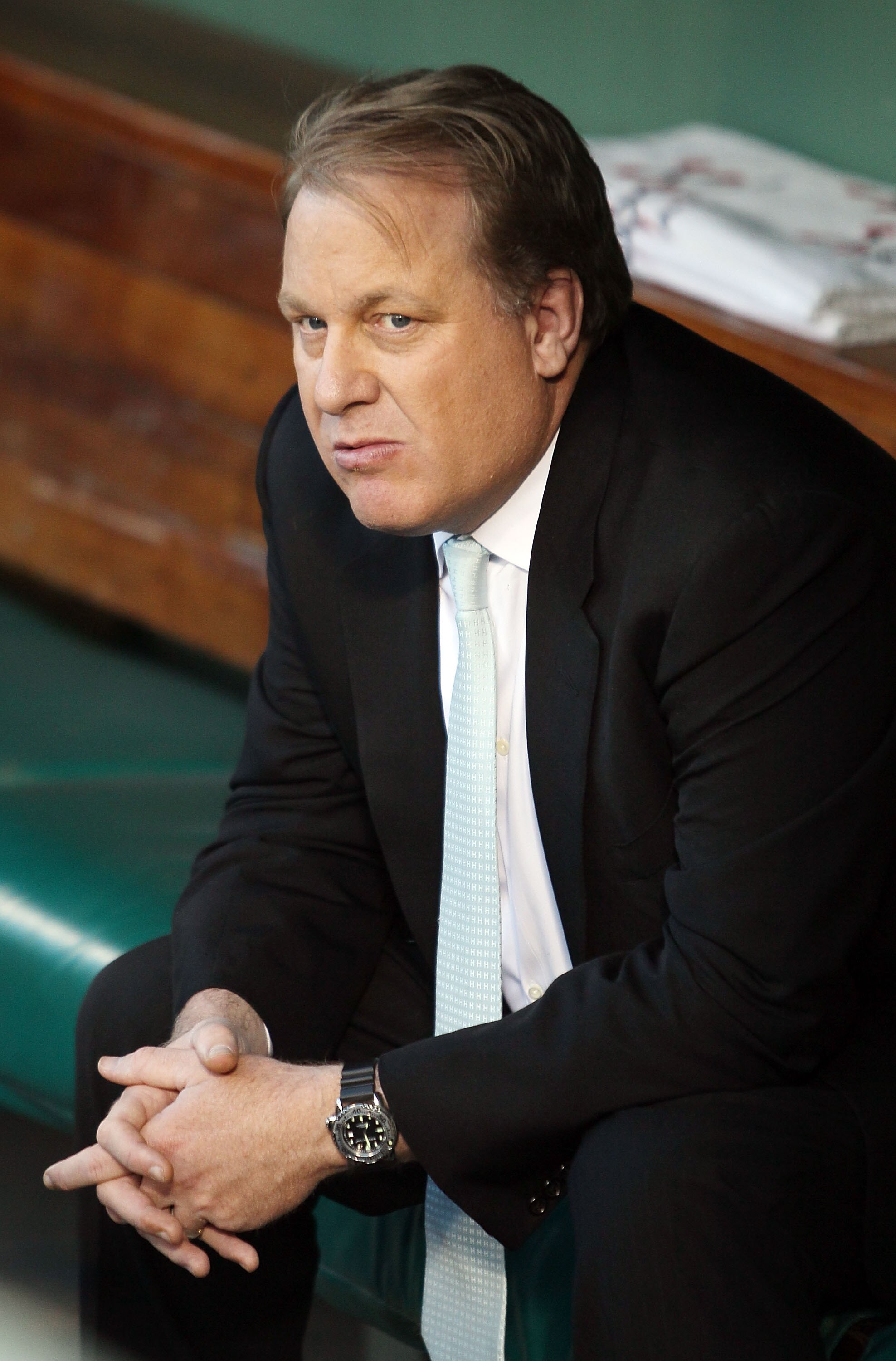 BOSTON - APRIL 04:  Former Boston Red Sox pitcher Curt Schilling sits in the dugout before the home opener against the New York Yankees on April 4, 2010 during Opening Night at Fenway Park in Boston, Massachusetts.  (Photo by Elsa/Getty Images)