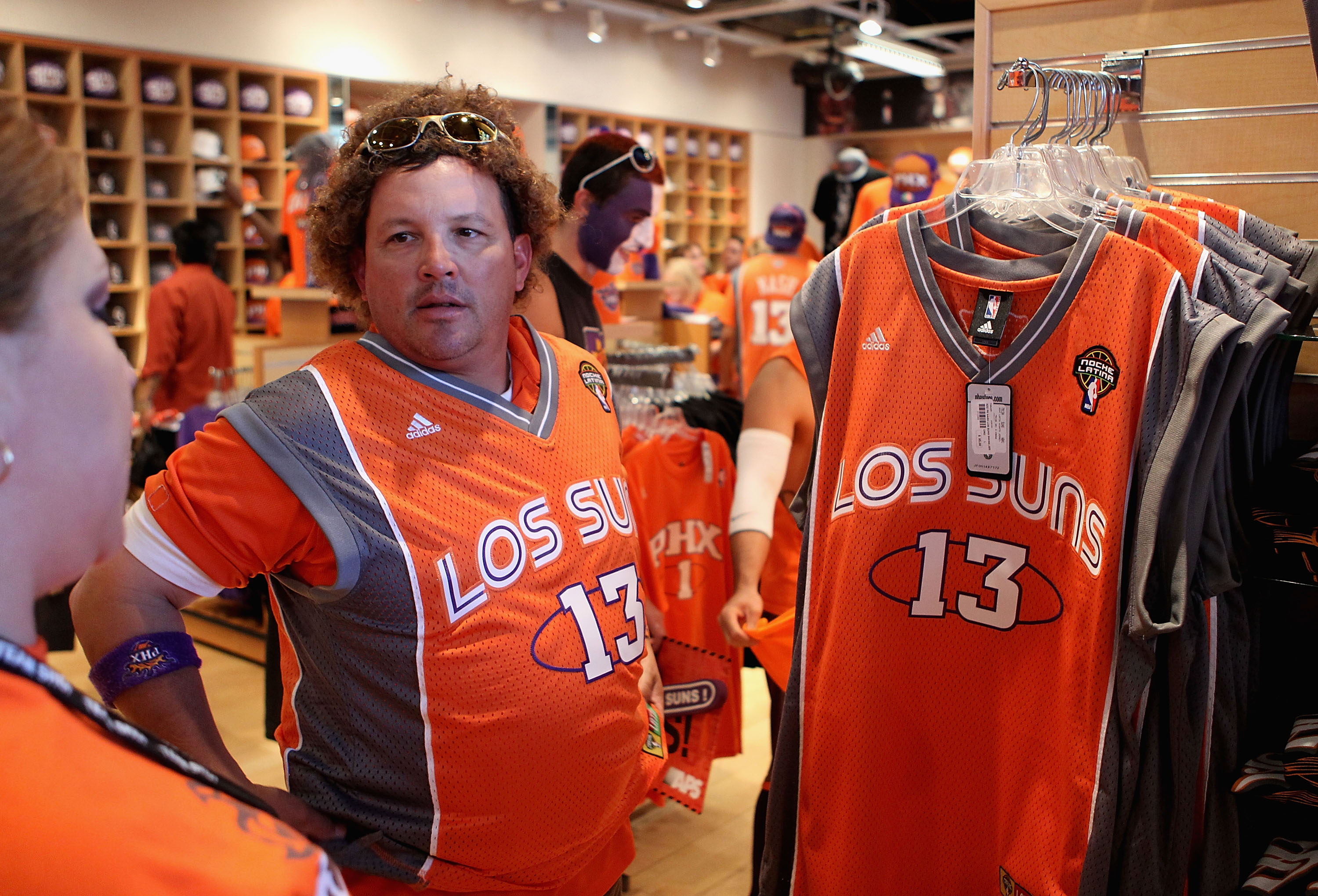 PHOENIX - MAY 05:  Phoenix Suns fan Jerry Rodriguez purchases a 'Los Suns' jersey before Game Two of the Western Conference Semifinals of the 2010 NBA Playoffs against the San Antonio Spurs at US Airways Center on May 5, 2010 in Phoenix, Arizona. The team