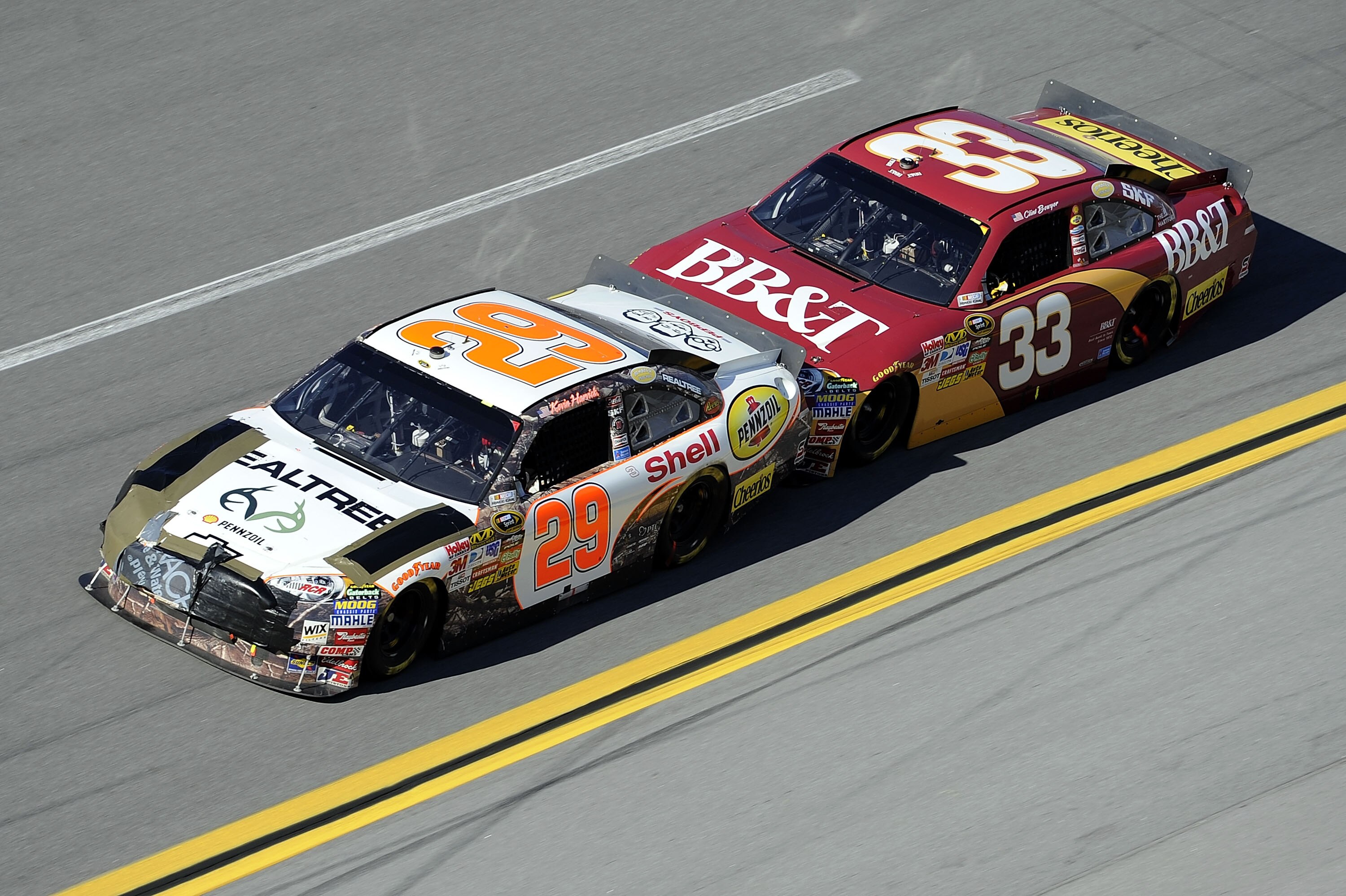 TALLADEGA, AL - OCTOBER 31: Kevin Harvick, driver of the #29 Realtree/Shell/Pennzoil Chevrolet, gets bump drafted by Clint Bowyer, driver of the #33 BB&T Chevrolet, during the NASCAR Sprint Cup Series AMP Energy Juice 500 at Talladega Superspeedway on Oct