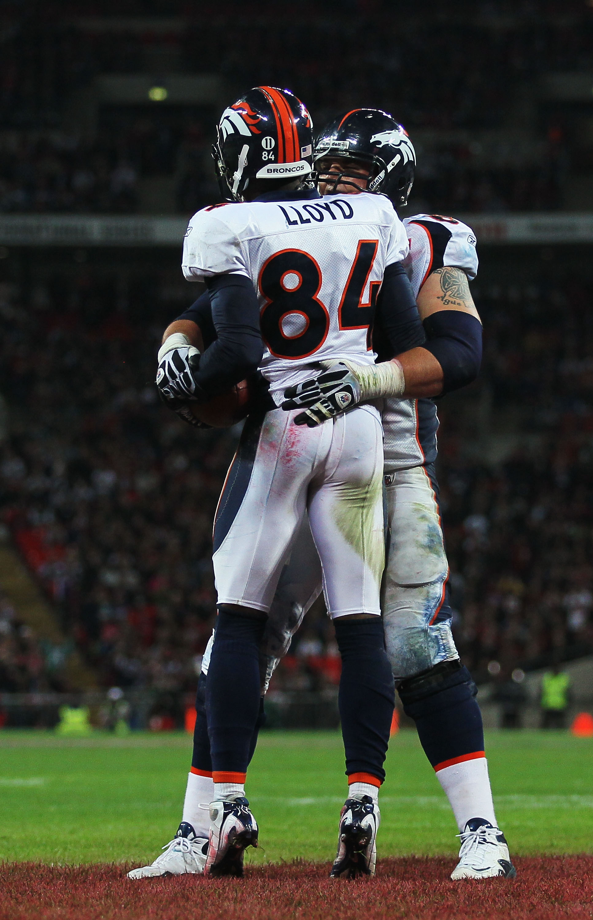 LONDON, ENGLAND - OCTOBER 31:  Brandon Lloyd #84 of Denver Broncos celebrates with Zane Beadles #68 as he scores their second touchdown during the NFL International Series match between Denver Broncos and San Francisco 49ers at Wembley Stadium on October