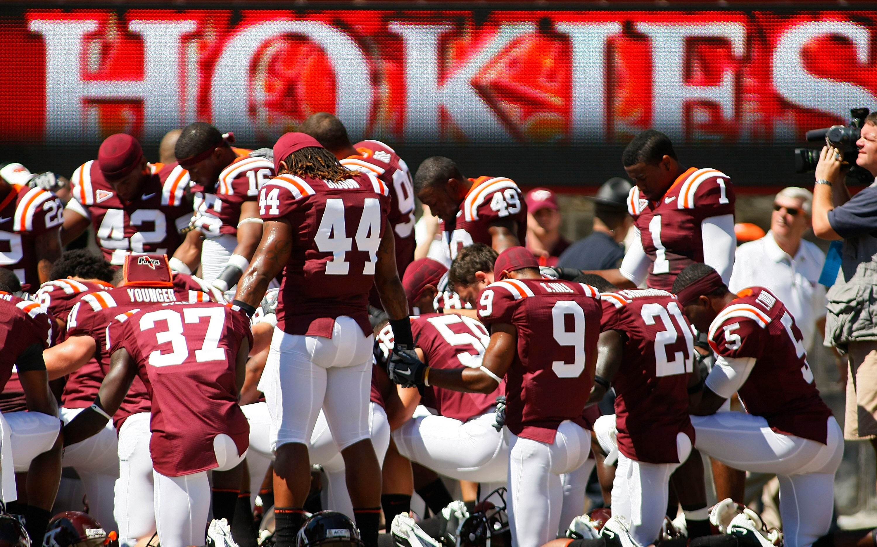 BLACKSBURG, VA - SEPTEMBER 18:  Virginia Tech Hokies players meet prior to the Hokies game against the East Carolina Pirates at Lane Stadium on September 18, 2010 in Blacksburg, Virginia.  (Photo by Geoff Burke/Getty Images)