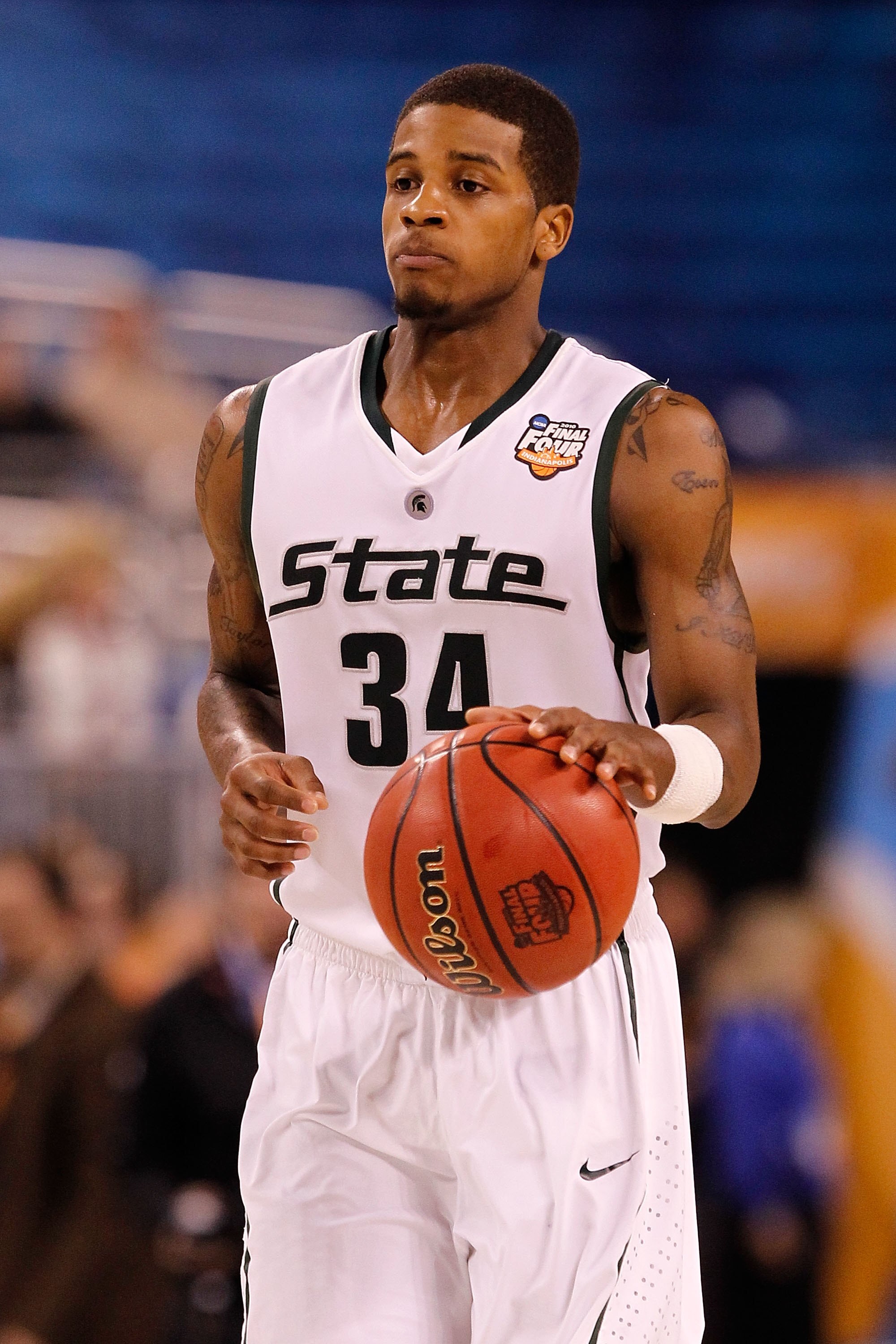 INDIANAPOLIS - APRIL 03:  Korie Lucious #34 of the Michigan State Spartans with the ball against the Butler Bulldogs during the National Semifinal game of the 2010 NCAA Division I Men's Basketball Championship on April 3, 2010 in Indianapolis, Indiana.  (