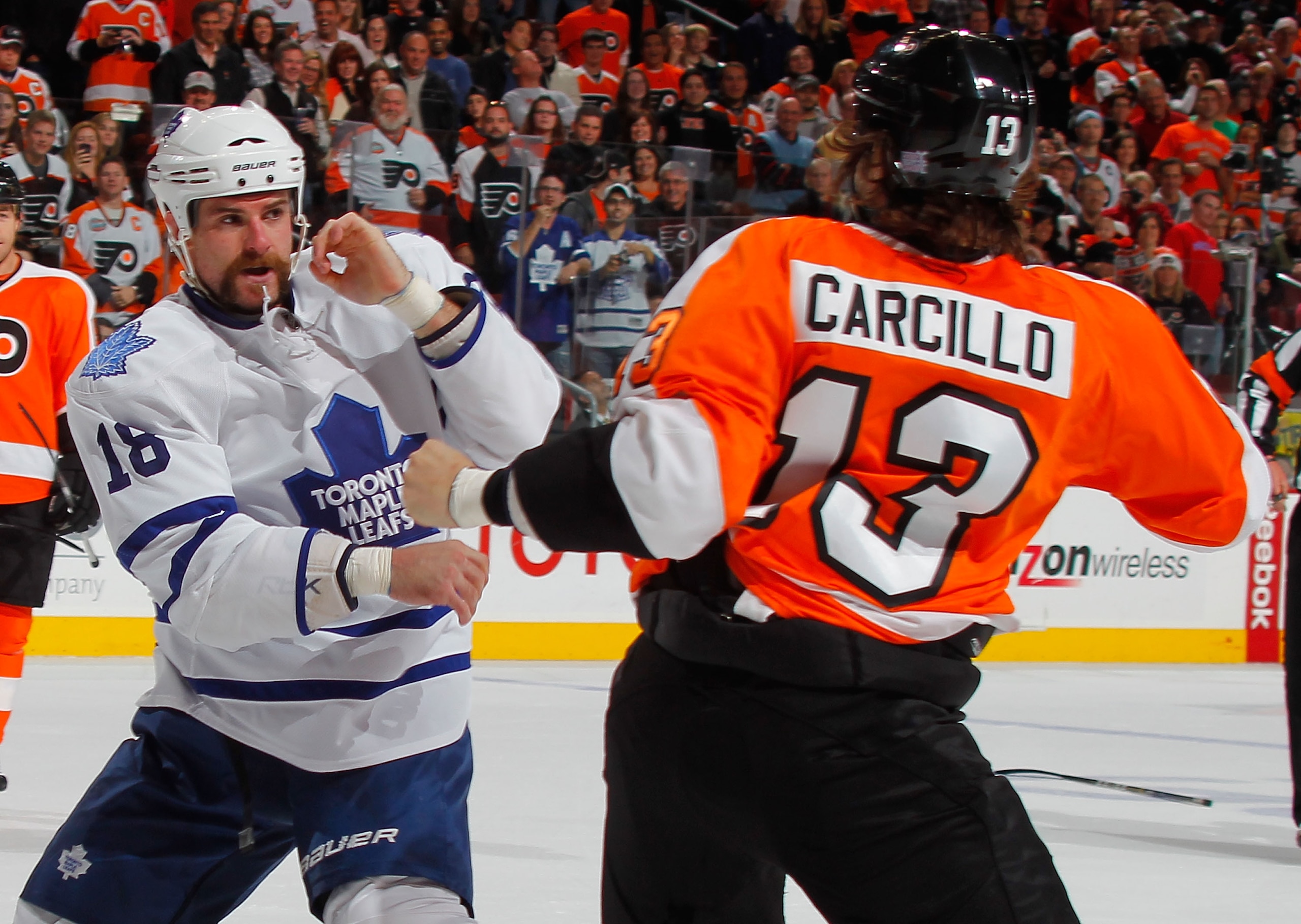 PHILADELPHIA - OCTOBER 23: Mike Brown #18 of the Toronto Maple Leafs fights with Daniel Carcillo #13 of the Philadelphia Flyers in the first period of a hockey game at the Wells Fargo Center on October 23, 2010 in Philadelphia, Pennsylvania. (Photo by Pa PHILADELPHIA - OCTOBER 23: Mike Brown #18 of the Toronto Maple Leafs fights with Daniel Carcillo #13 of the Philadelphia Flyers in the first period of a hockey game at the Wells Fargo Center on October 23, 2010 in Philadelphia, Pennsylvania. (Photo by Pa