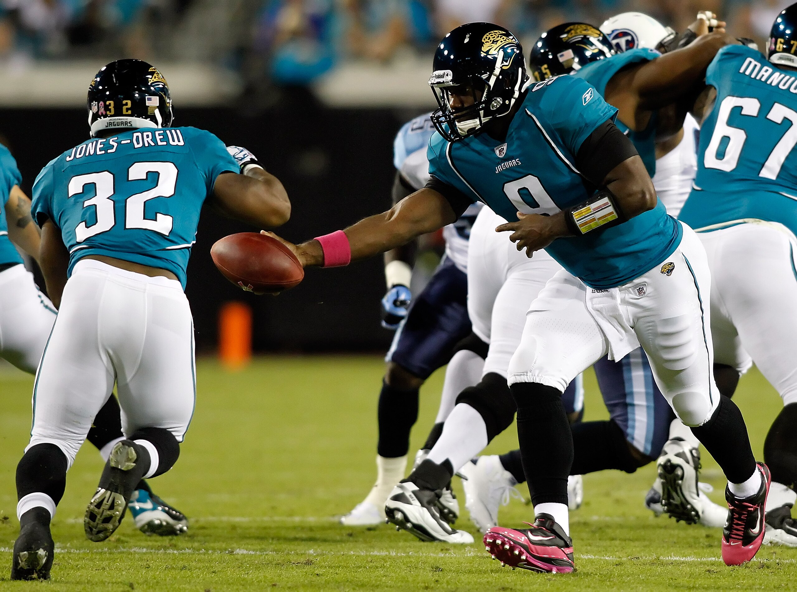 JACKSONVILLE, FL - OCTOBER 18:  Quarterback David Garrard #9 of the Jacksonville Jaguars hands the ball off to running back Maurice Jones-Drew #32 against the Tennessee Titans during the game at EverBank Field on October 18, 2010 in Jacksonville, Florida.