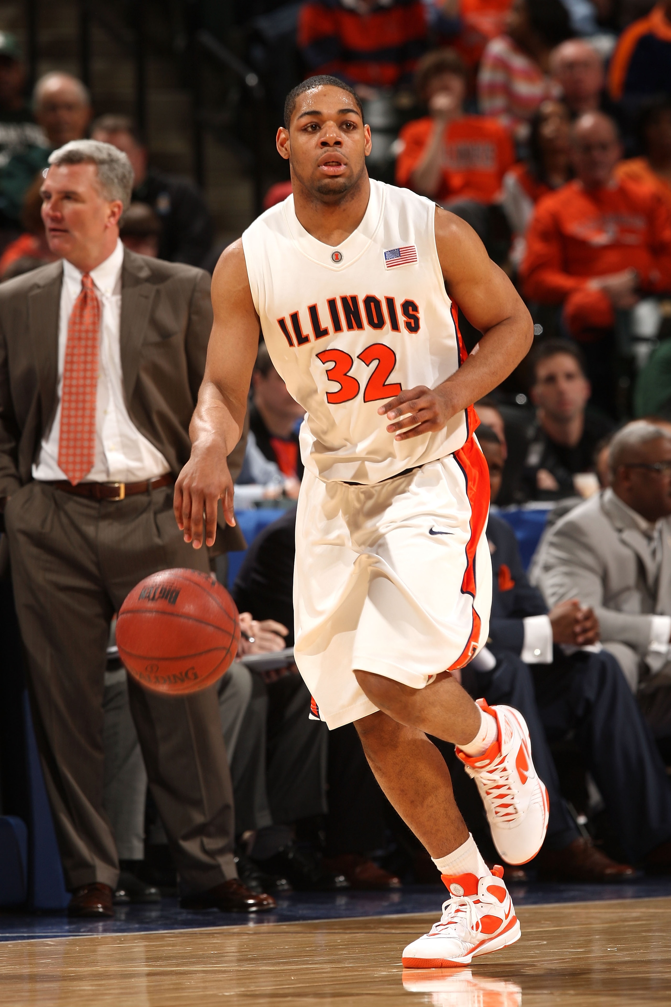 INDIANAPOLIS - MARCH 13:  Demetri McCamey #32 of the Illinois Fighting Illini brings the ball up court against the Michigan Wolverines during the second round of the Big Ten Men's Basketball Tournament at Conseco Fieldhouse on March 13, 2009 in Indianapol
