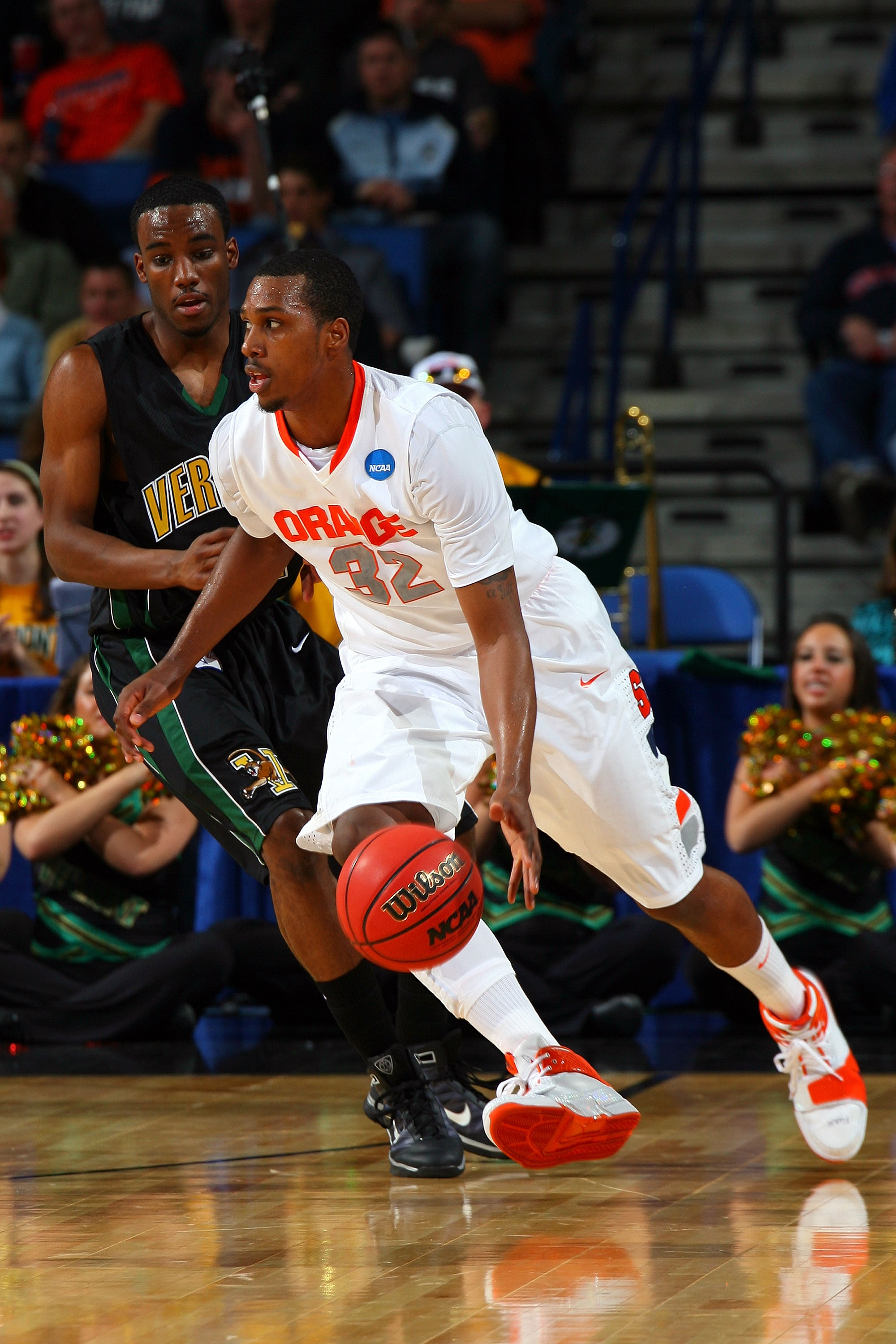 BUFFALO, NY - MARCH 19:  Garvey Young #21 of the Vermont Catamounts defends Kris Joseph #32 of the Syracuse Orange during the first round of the 2010 NCAA men's basketball tournament at HSBC Arena on March 19, 2010 in Buffalo, New York.  (Photo by Rick St