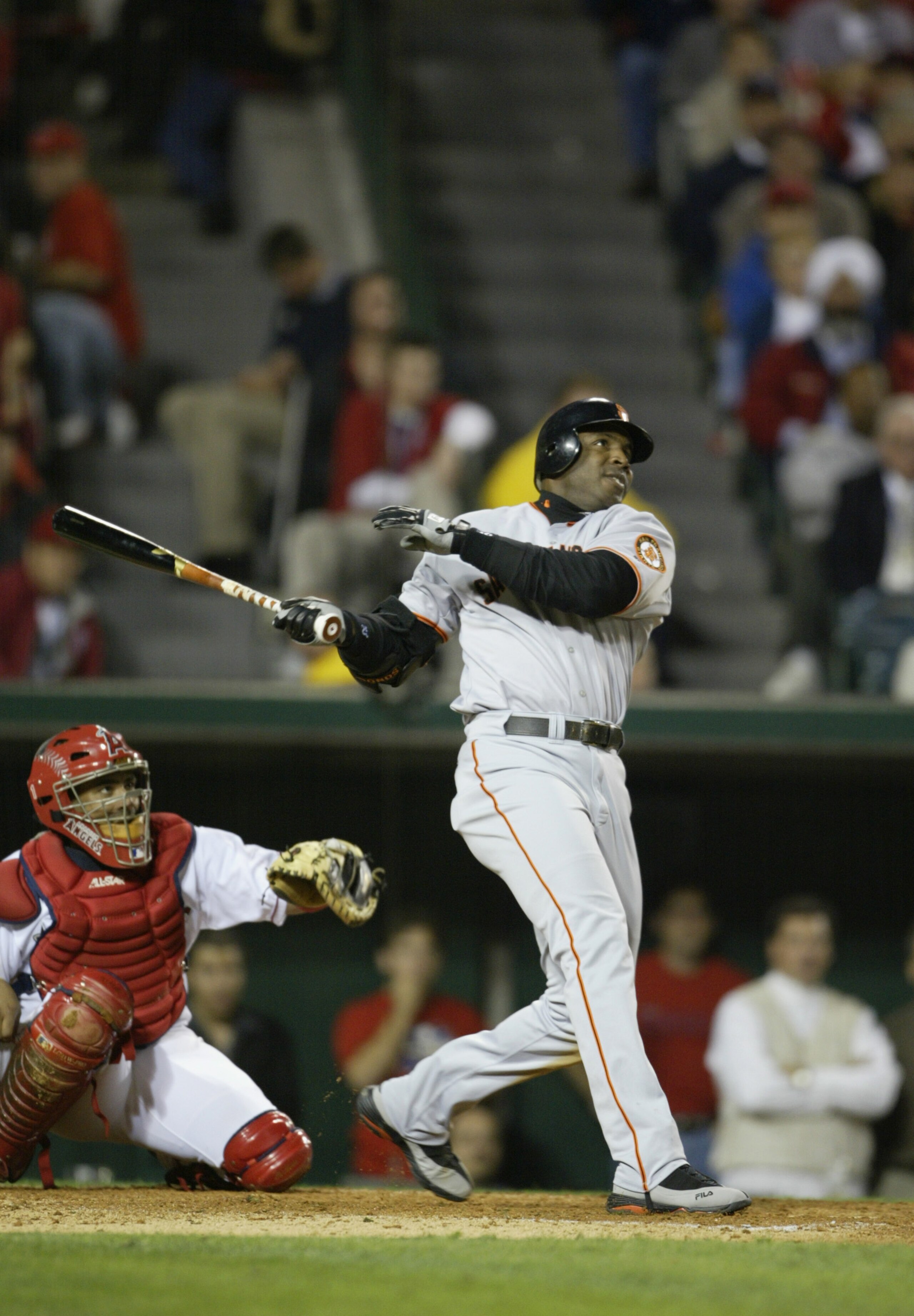 ANAHEIM, CA - OCTOBER 26:  Barry Bonds #25 of the San Francisco Giants hits a home run in the sixth inning giving the Giants a 4-0 lead in game six of the World Series against the Anaheim Angels on October 26, 2002 at Edison Field in Anaheim, California.