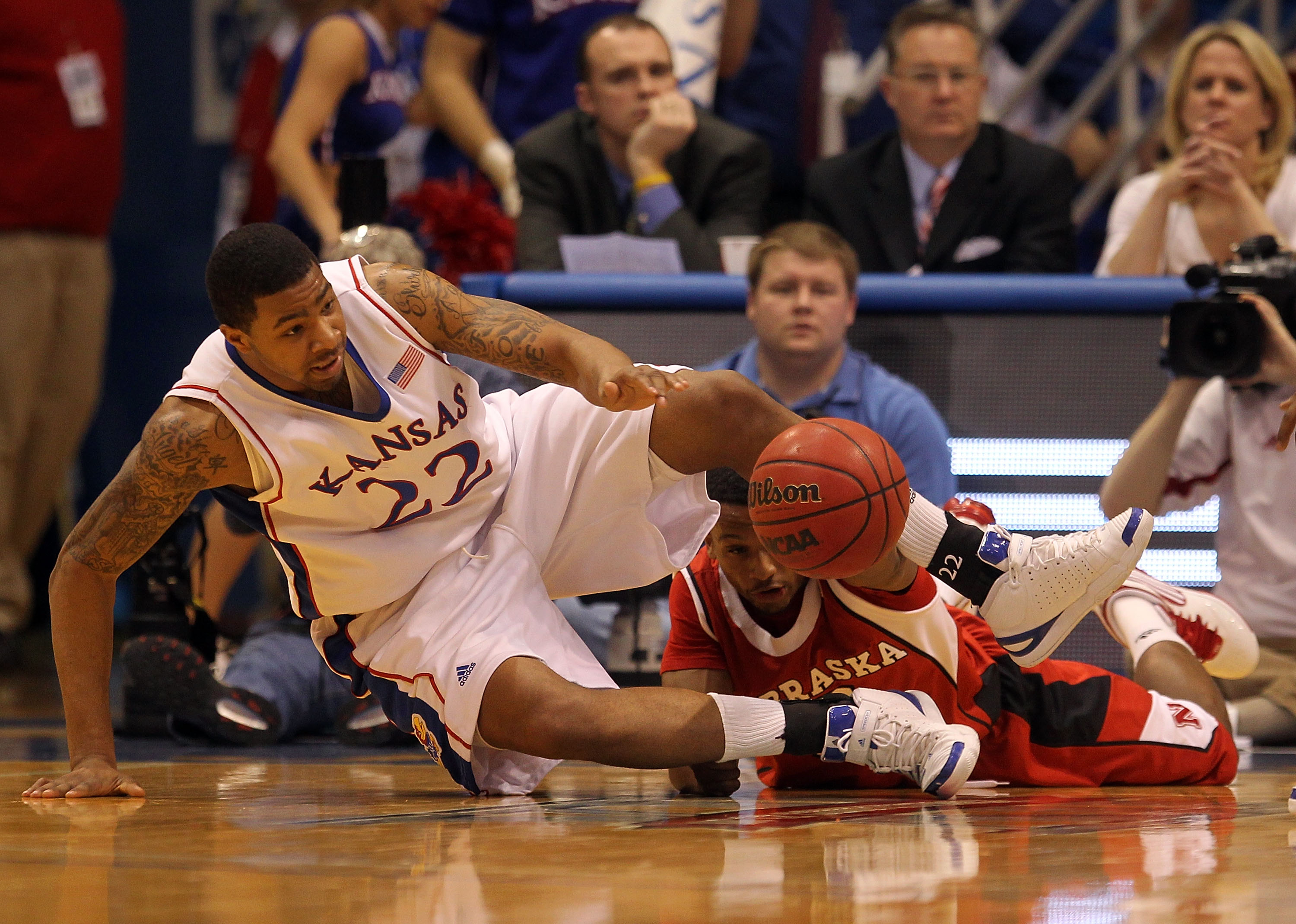 LAWRENCE, KS - FEBRUARY 06:  Marcus Morris #22 of the Kansas Jayhawks and Brandon Richardson #3 of the Nebraska Cornhuskers scramble for a loose ball during the game on February 6, 2010 at Allen Fieldhouse in Lawrence, Kansas.  (Photo by Jamie Squire/Gett