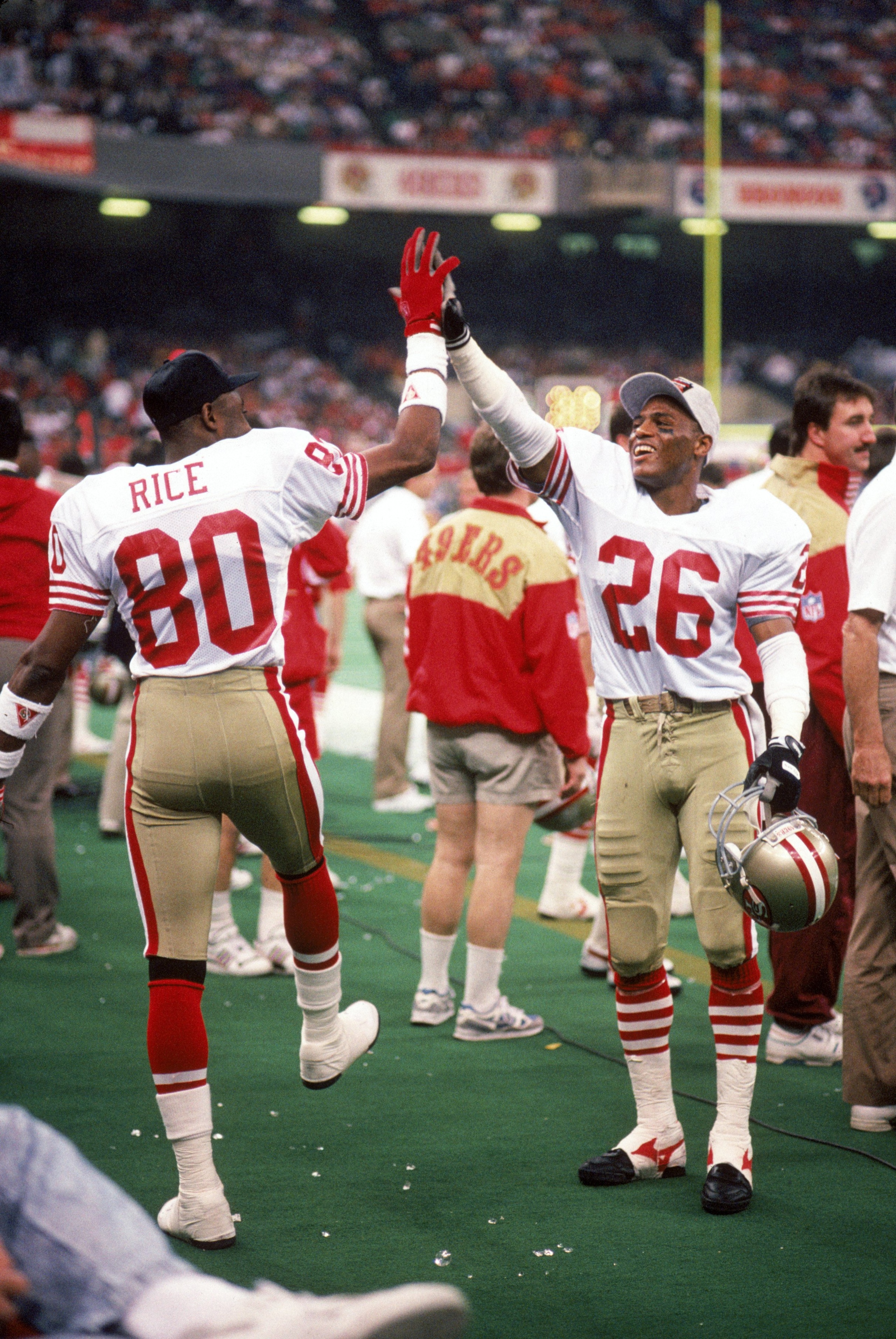 NEW ORLEANS - JANUARY 28:  Wide receiver New York Giants #80 and cornerback Darryl Pollard #26 of the San Francisco 49ers celebrate on the sideline in Super Bowl XXIV against the Denver Broncos at Louisiana Superdome on January 28, 1990 in New Orleans, Lo